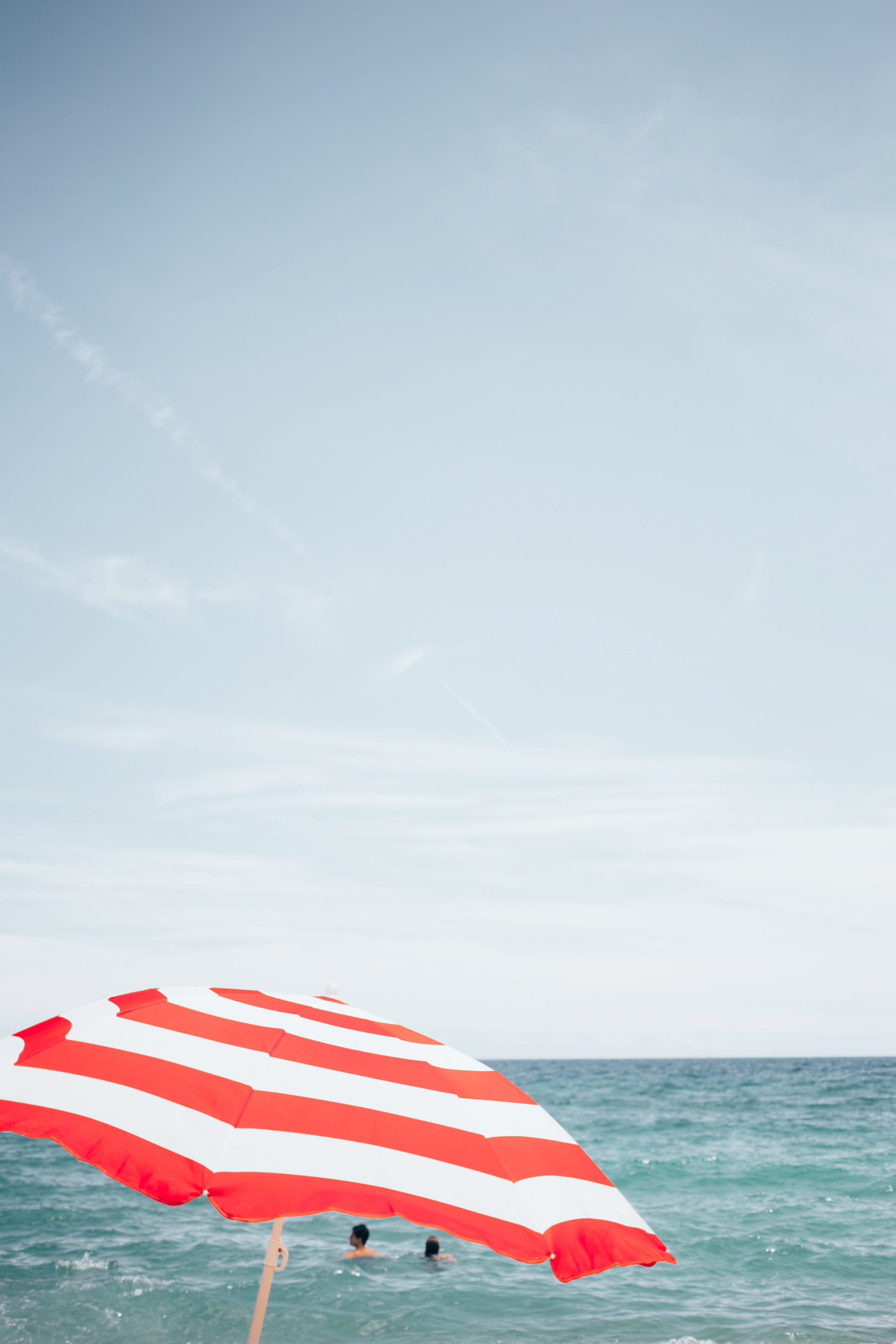 background, no people, red white, Swimming, striped, parasol, View, wind, vacation, Holiday, outdoors, Coast, Ocean, Bay, nature, 2K, Tropical, red, Umbrella, Phone HD Wallpaper
