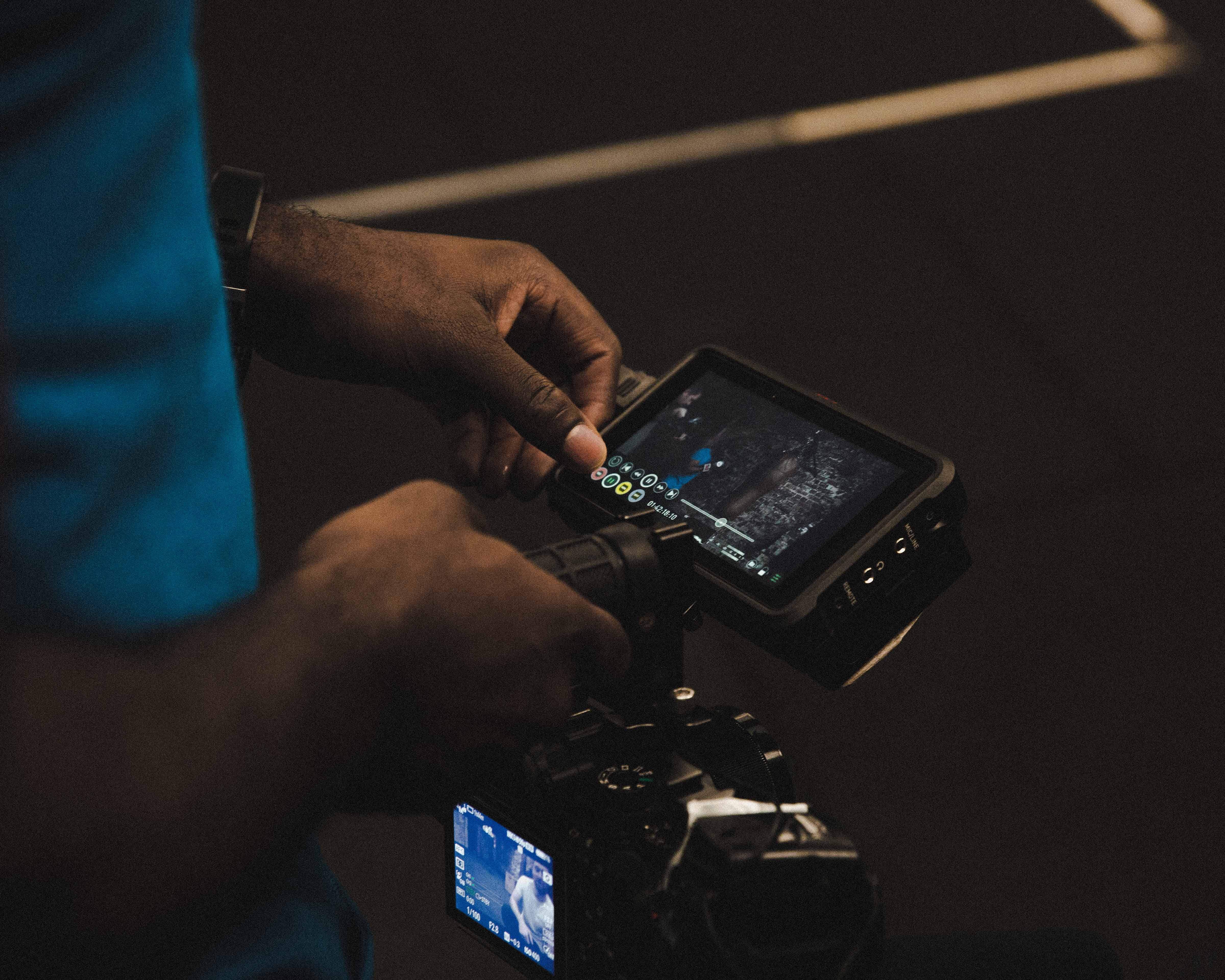 photography themes, video camera, occupation, flooring, connection, one person, camera, digital camera, communication, wood, screen, working, hand, human body part, HD Wallpaper