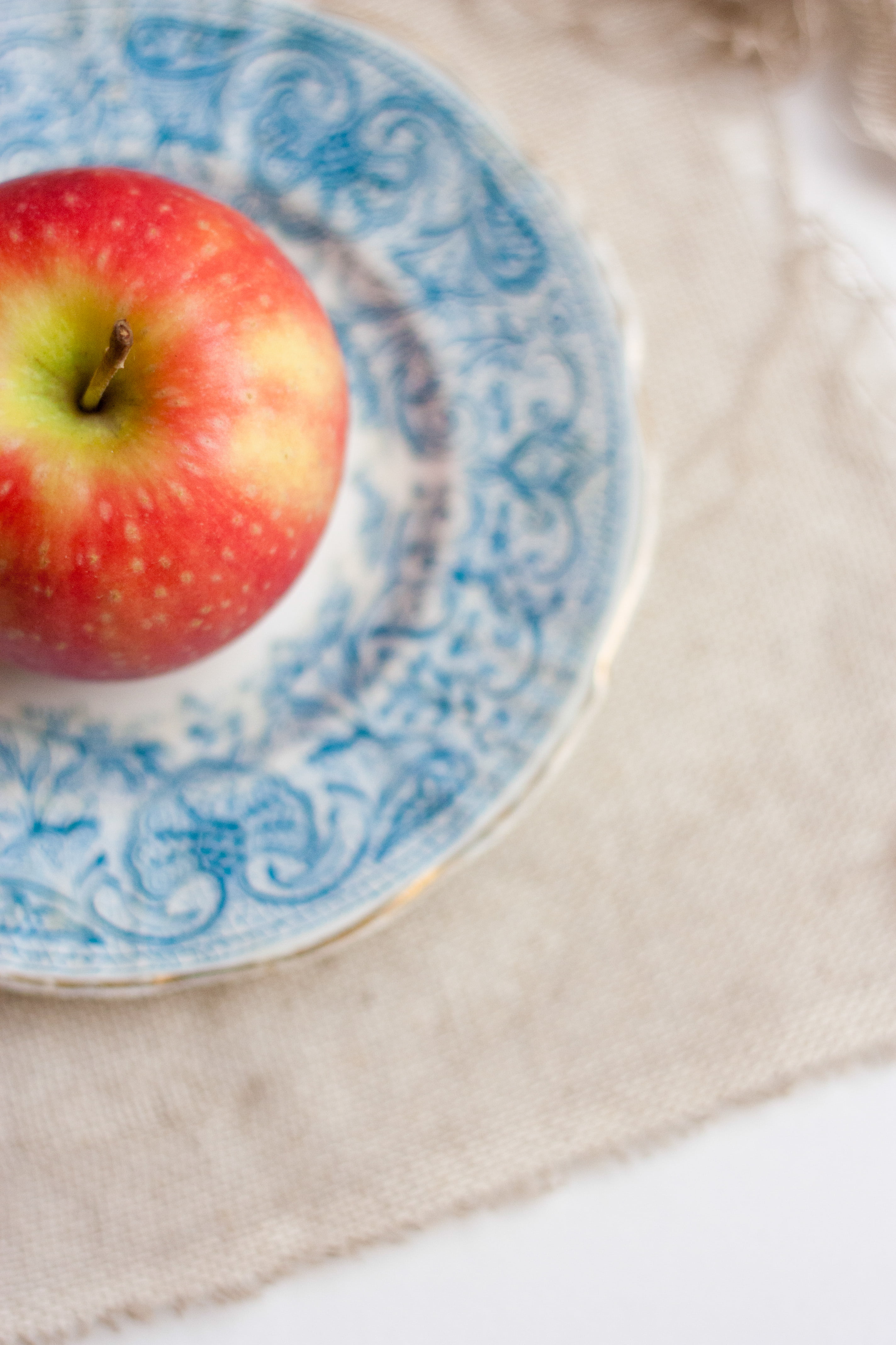fruit, honeycrisp, focus on foreground, indoors, juicy, blue, floral, plate, food, studio shot, high angle view, no people, freshness, wellbeing, healthy lifestyle, Phone HD Wallpaper