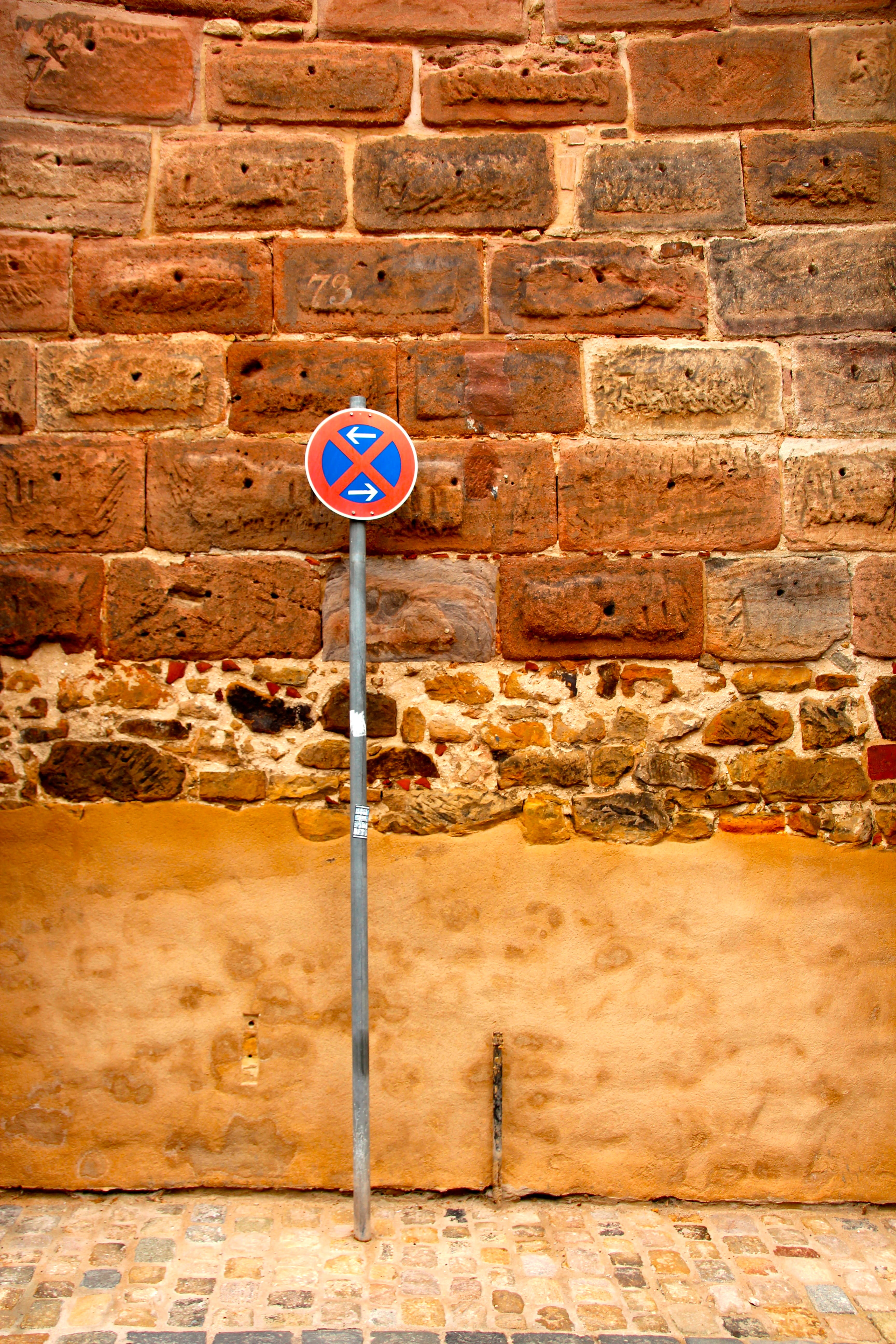 warning sign, traffic, arrow symbol, street sign, wall, brick, stone wall, information, traffic sign, prohibited, no people, 5K, wall - building feature, Phone HD Wallpaper