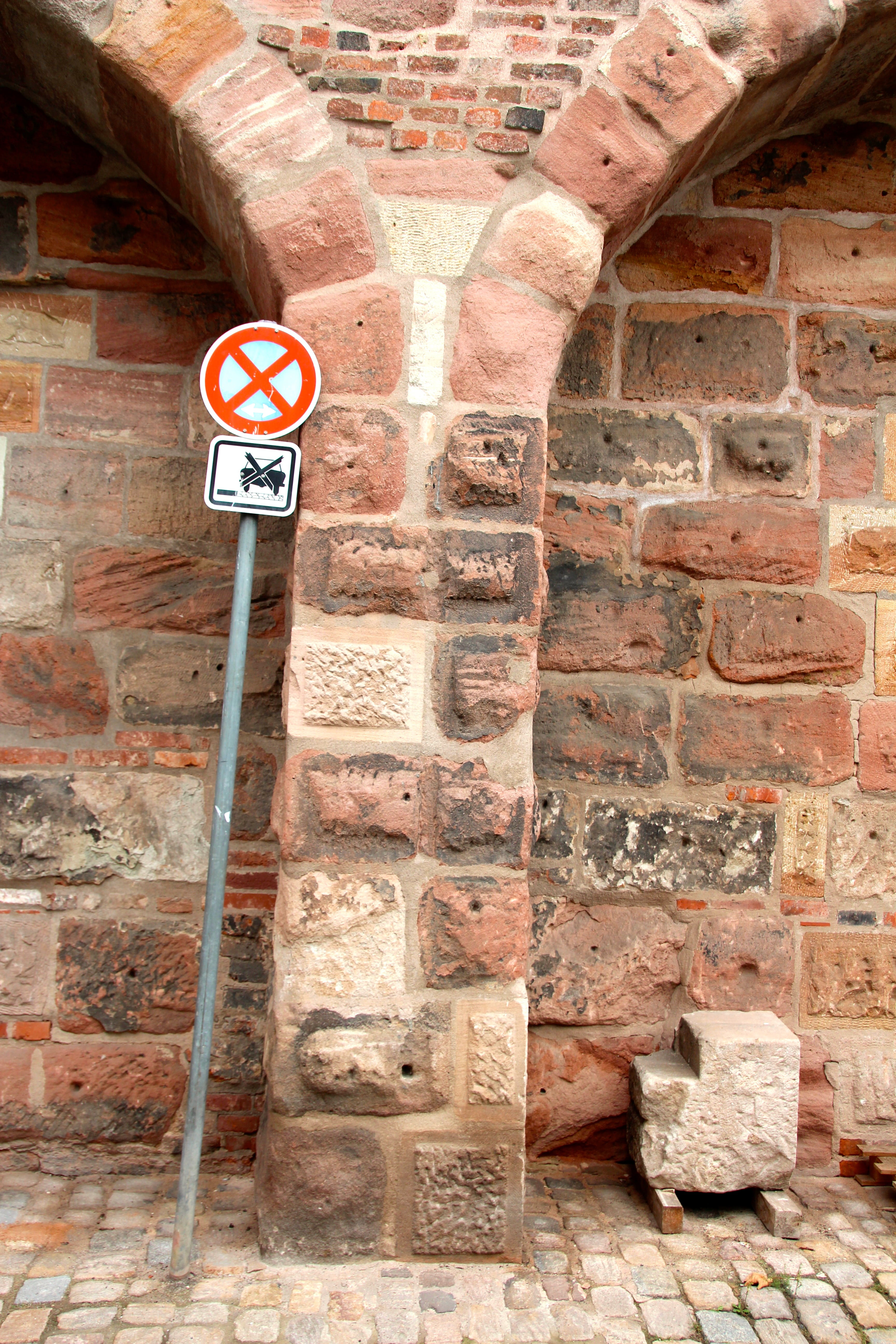 brick wall, direction, street sign, built structure, text, wall, prohibited, traffic sign, 5K, no people, sign, no parking, architecture, road sign, stone wall, Phone HD Wallpaper