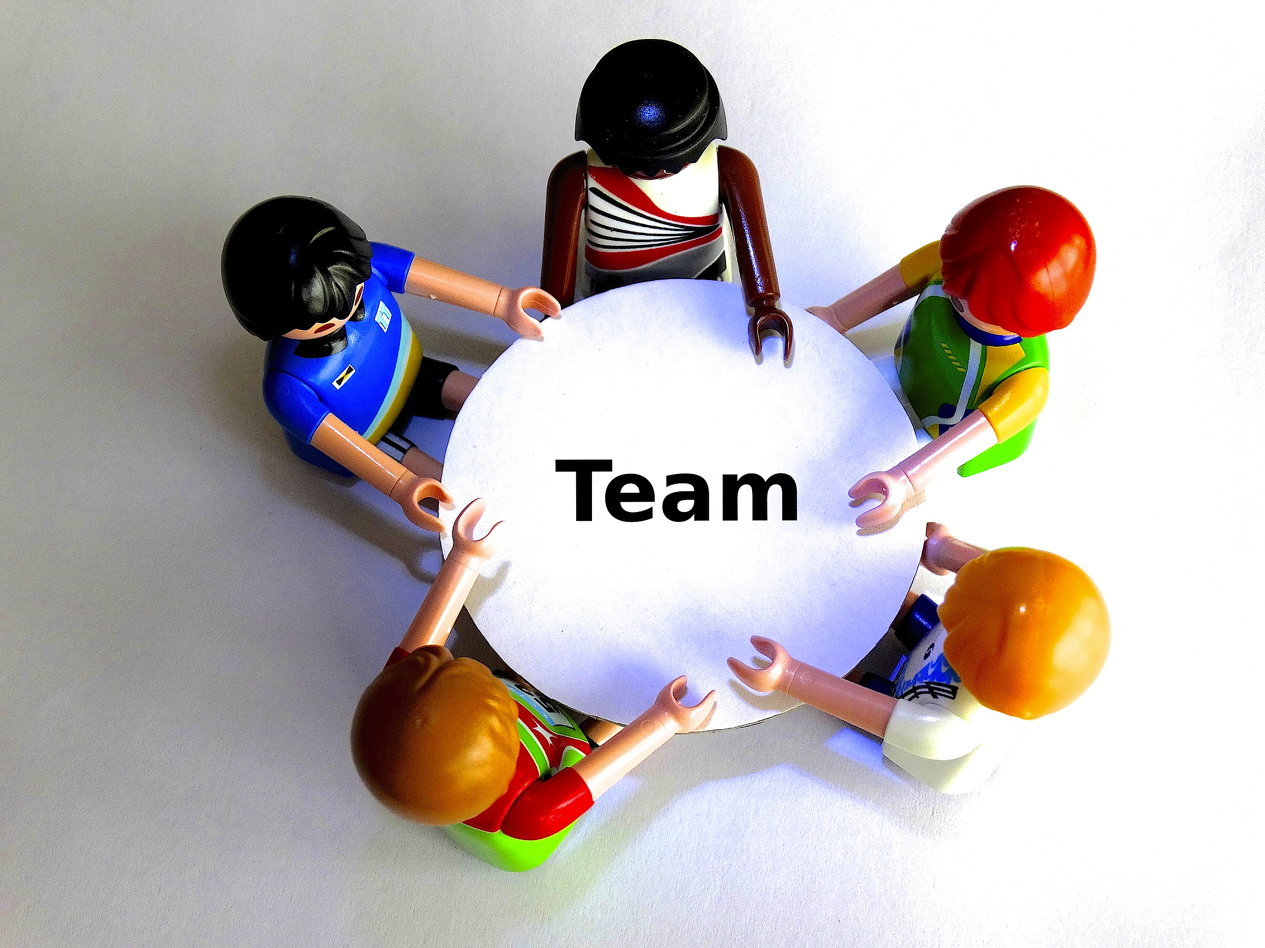 real people, indoors, helmet, playmobil, people, solution search, round table, white background, talk, 2K, high angle view, team, communication, management, HD Wallpaper