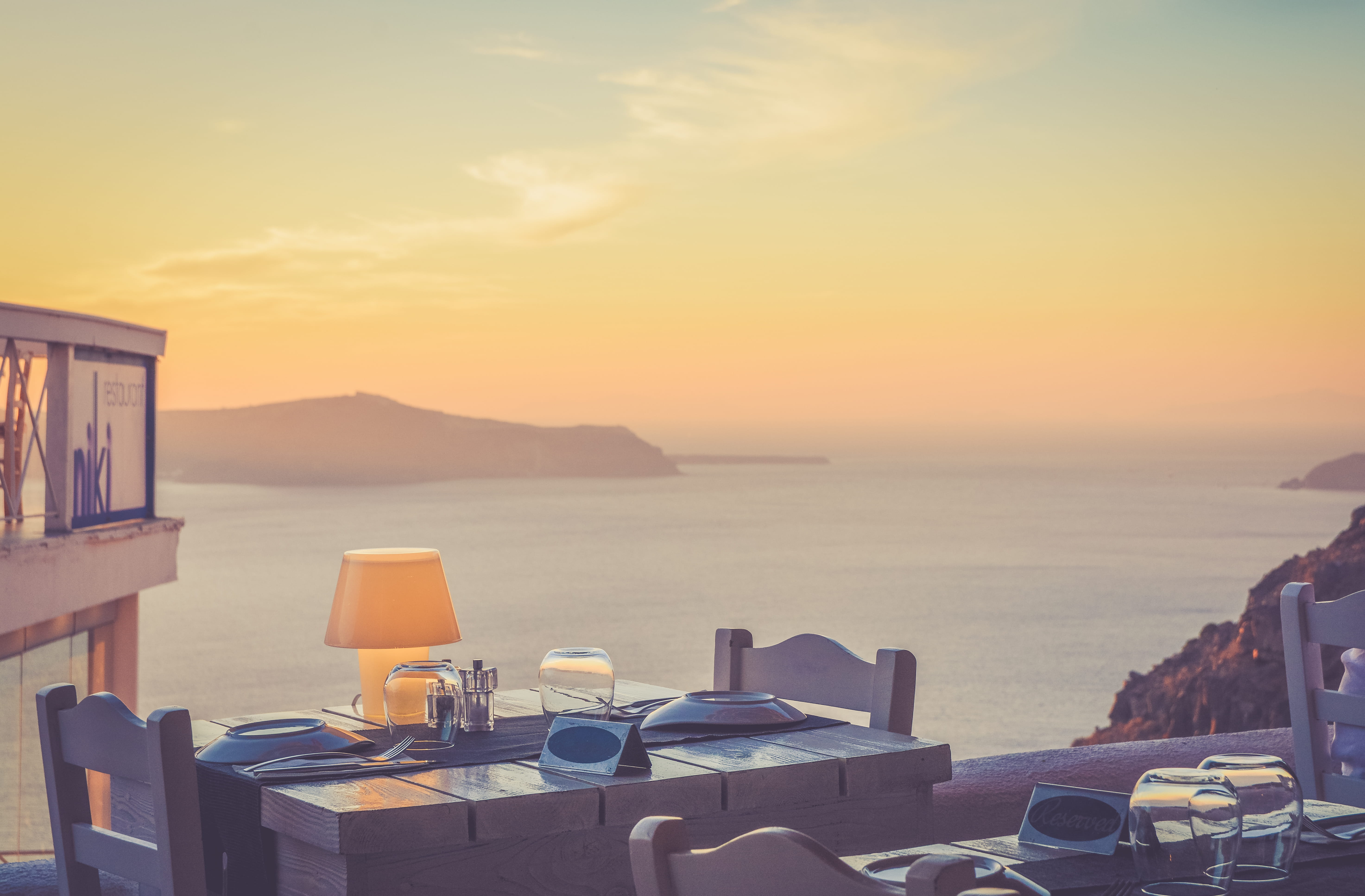 setting, glass, seat, nature, view, orange color, tranquility, sea, absence, table, ocean, chair, sunset, romantic, holiday, dinner, mountain, sky, island, HD Wallpaper