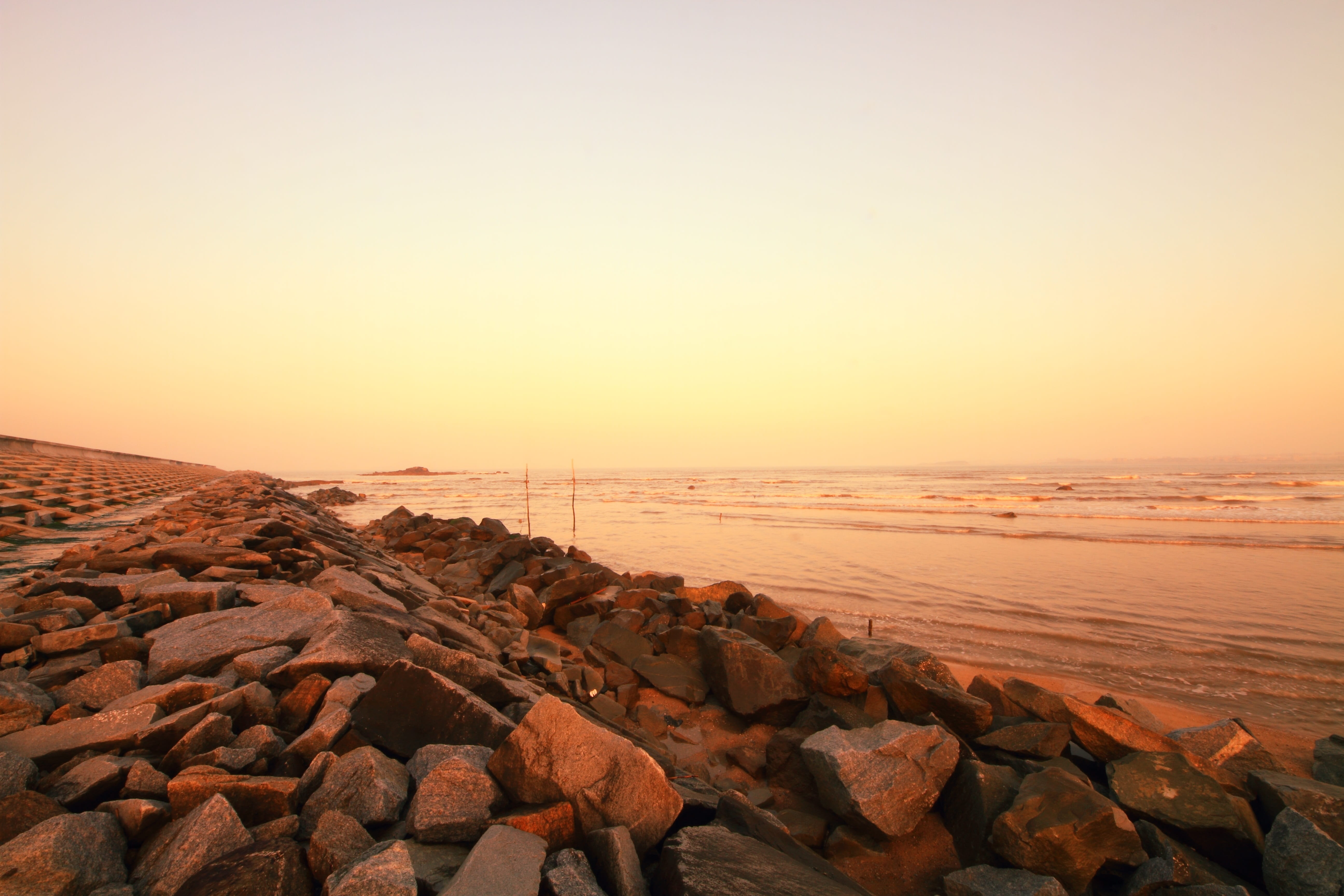 sunset, tranquil scene, pebble, no people, solid, 5K, beauty in nature, tranquility, nature, beach, horizon, copy space, moisture provide, coast, sky, HD Wallpaper