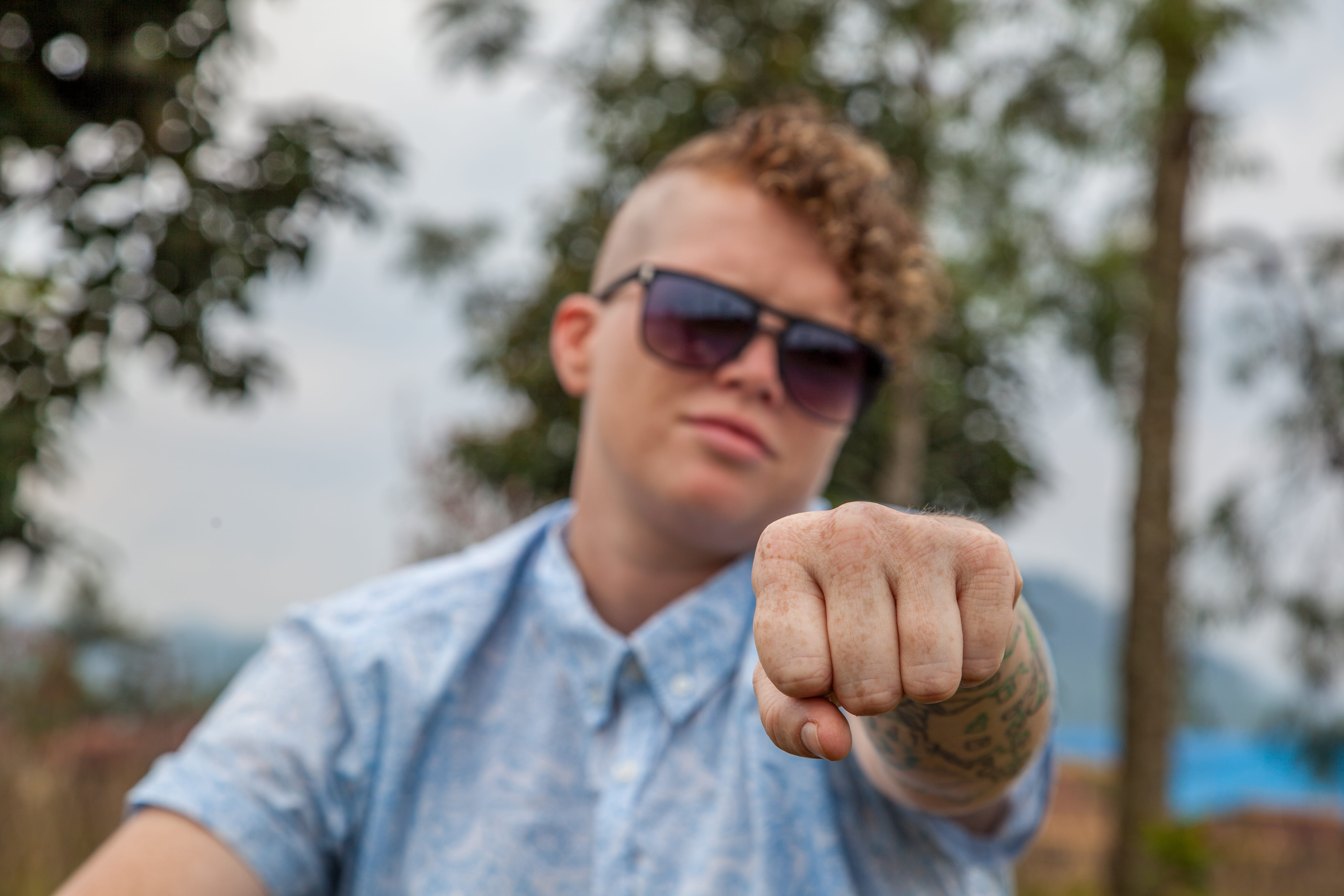 focus on foreground, fist, finger, front view, headshot, fashion, gesture, collar, human body part, 5K, looking at camera, wearing, glasses, male, leisure activity, HD Wallpaper