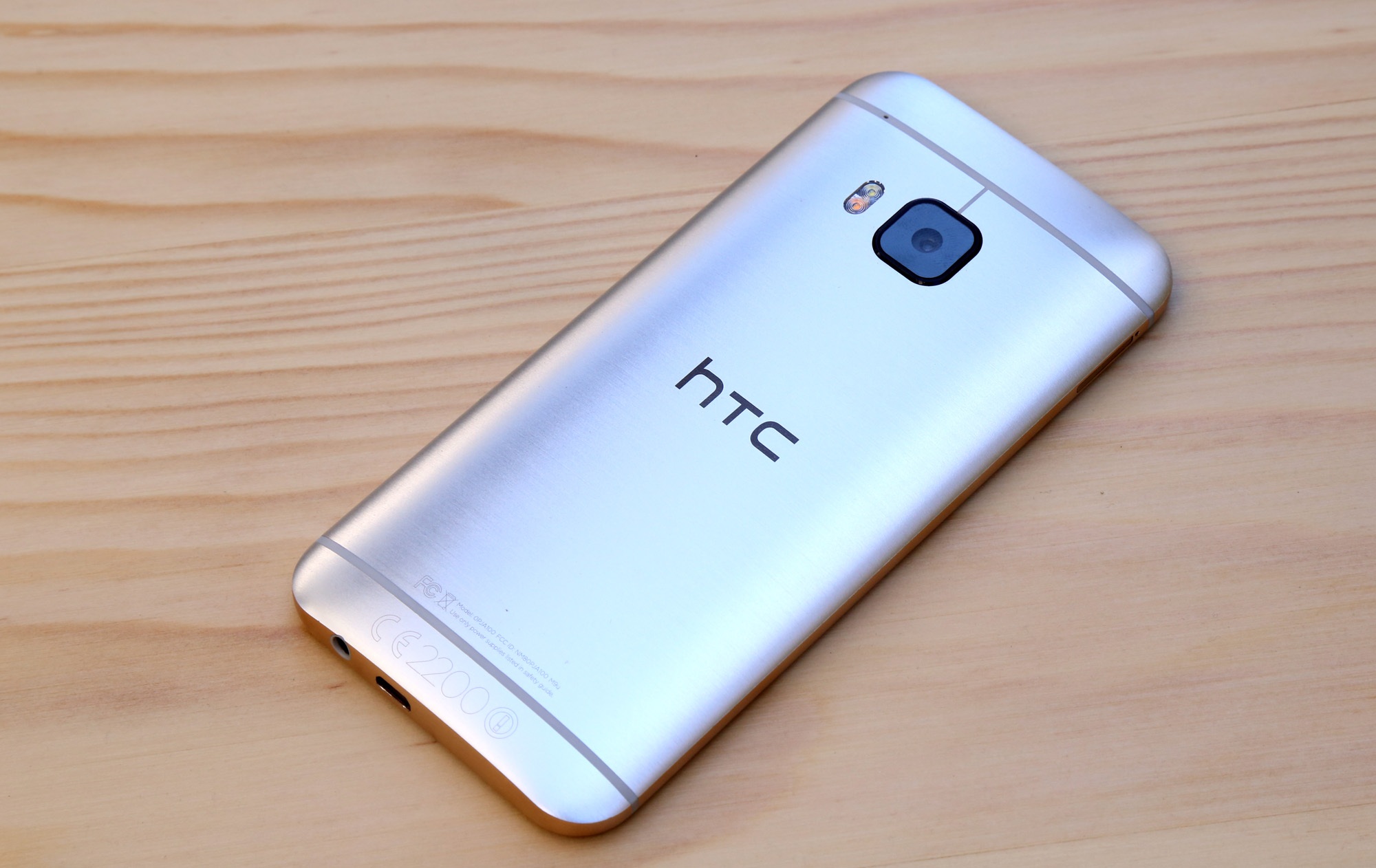 capital letter, htc one m8, mobile phone, brown, silver, desire, mobile, still life, htc, one, single object, indoors, smart phone, wireless technology, HD Wallpaper