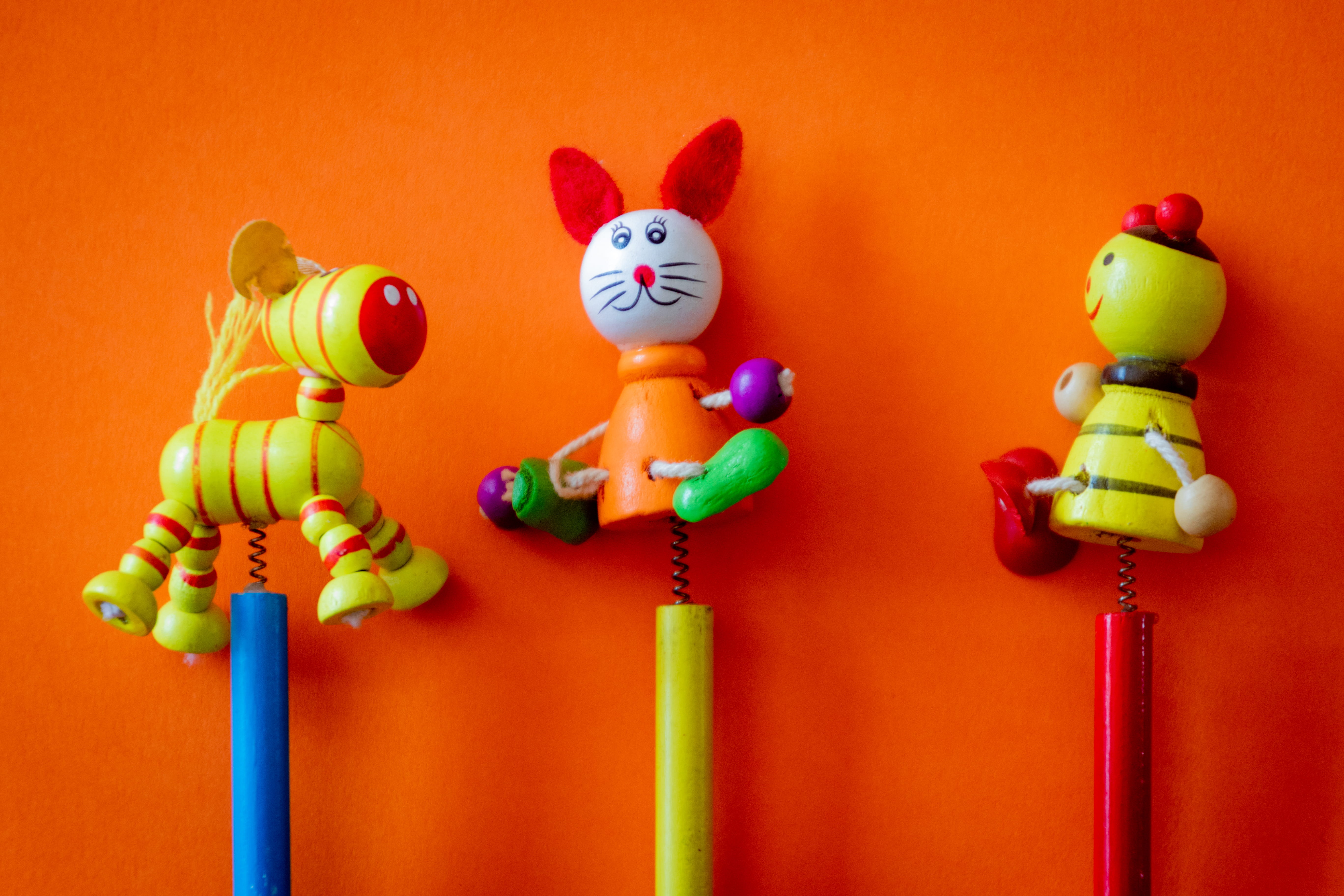 red, orange, studio shot, human representation, mammal, 5K, colorful, animals, art and craft, toy, three, figurine, black, yellow, doll, colors, indoors, HD Wallpaper