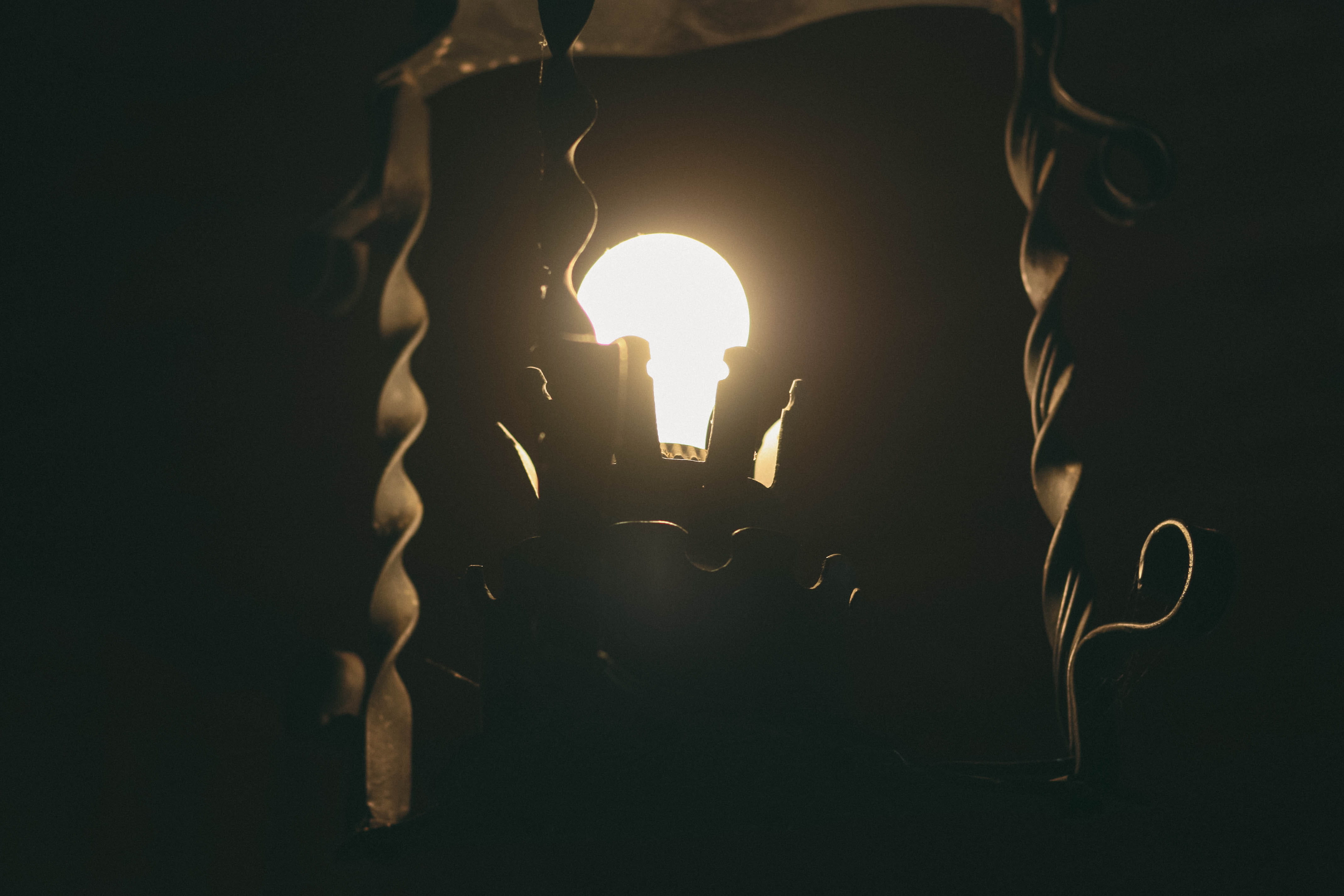 fire - natural phenomenon, dark, bulb, cabin, close-up, illuminated, candle, black background, united states, tishomingo, women, iron, fixture, 4K, indoors, HD Wallpaper
