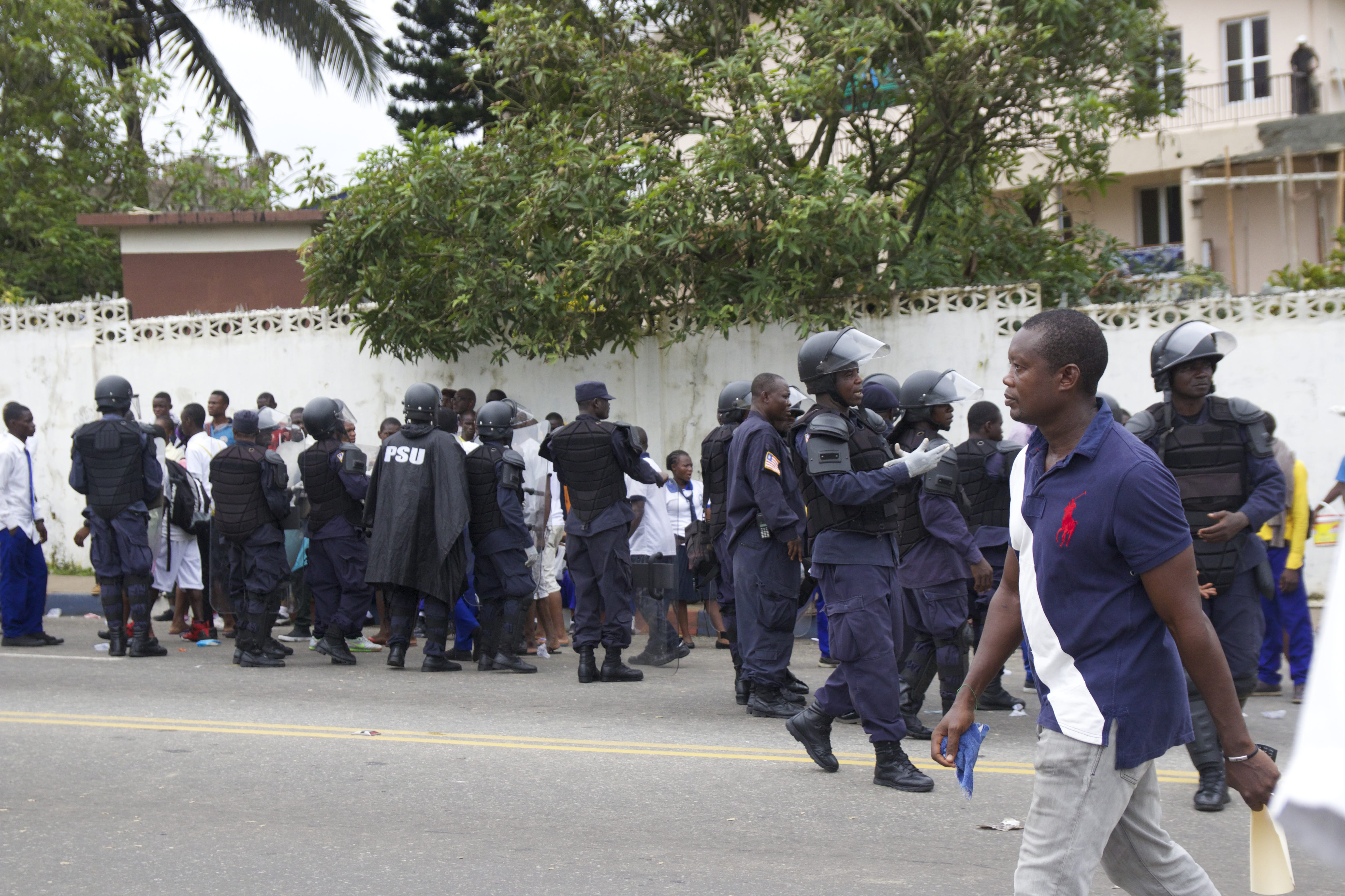 large group of people, liberia, crowd, waiting, street, architecture, protest, city, uniform, built structure, building exterior, police officers, africa, HD Wallpaper