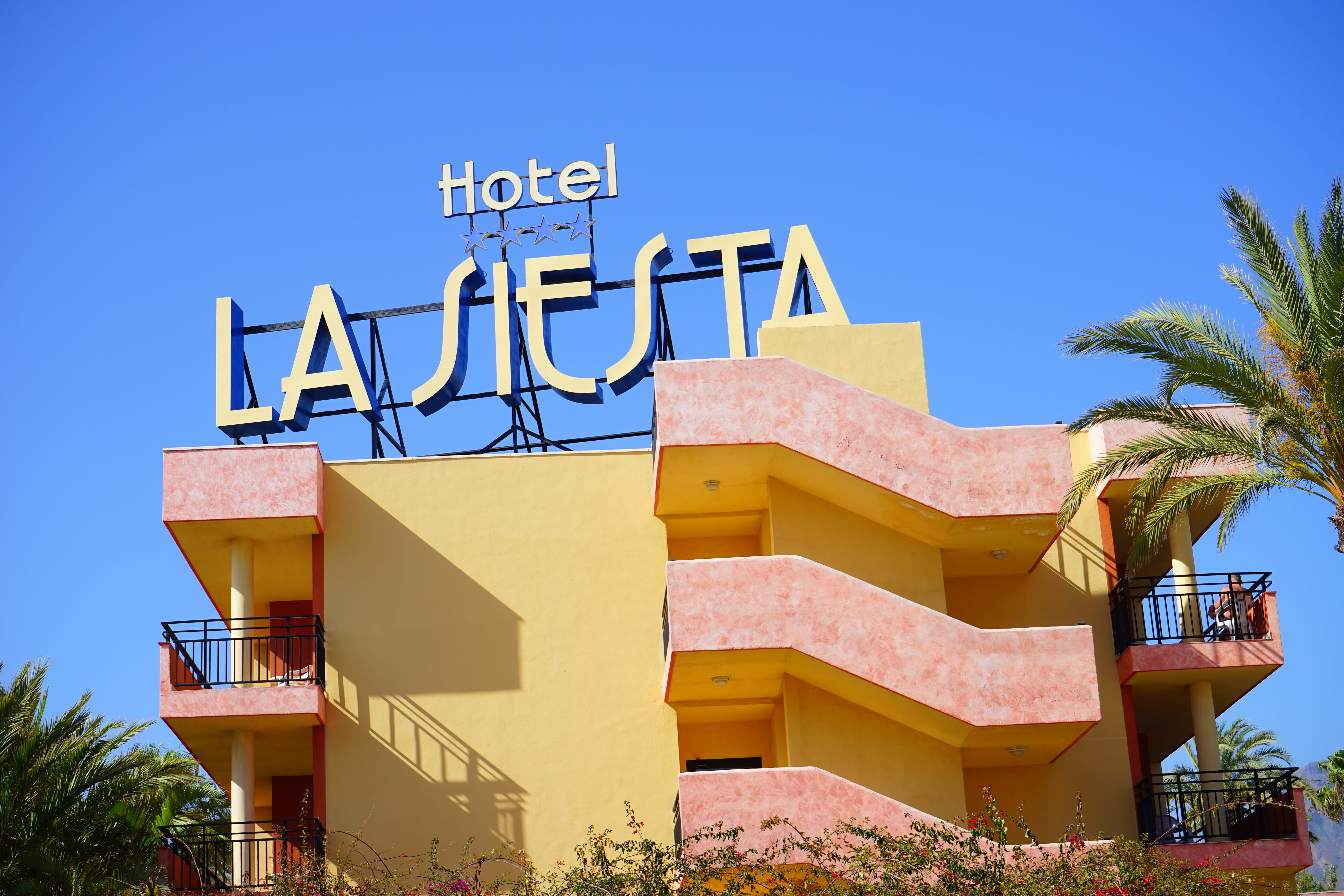 building, architecture, communication, built structure, tree, sign, americas, blue, yellow, clear sky, sky, western script, playa de las americas, tropical climate, HD Wallpaper