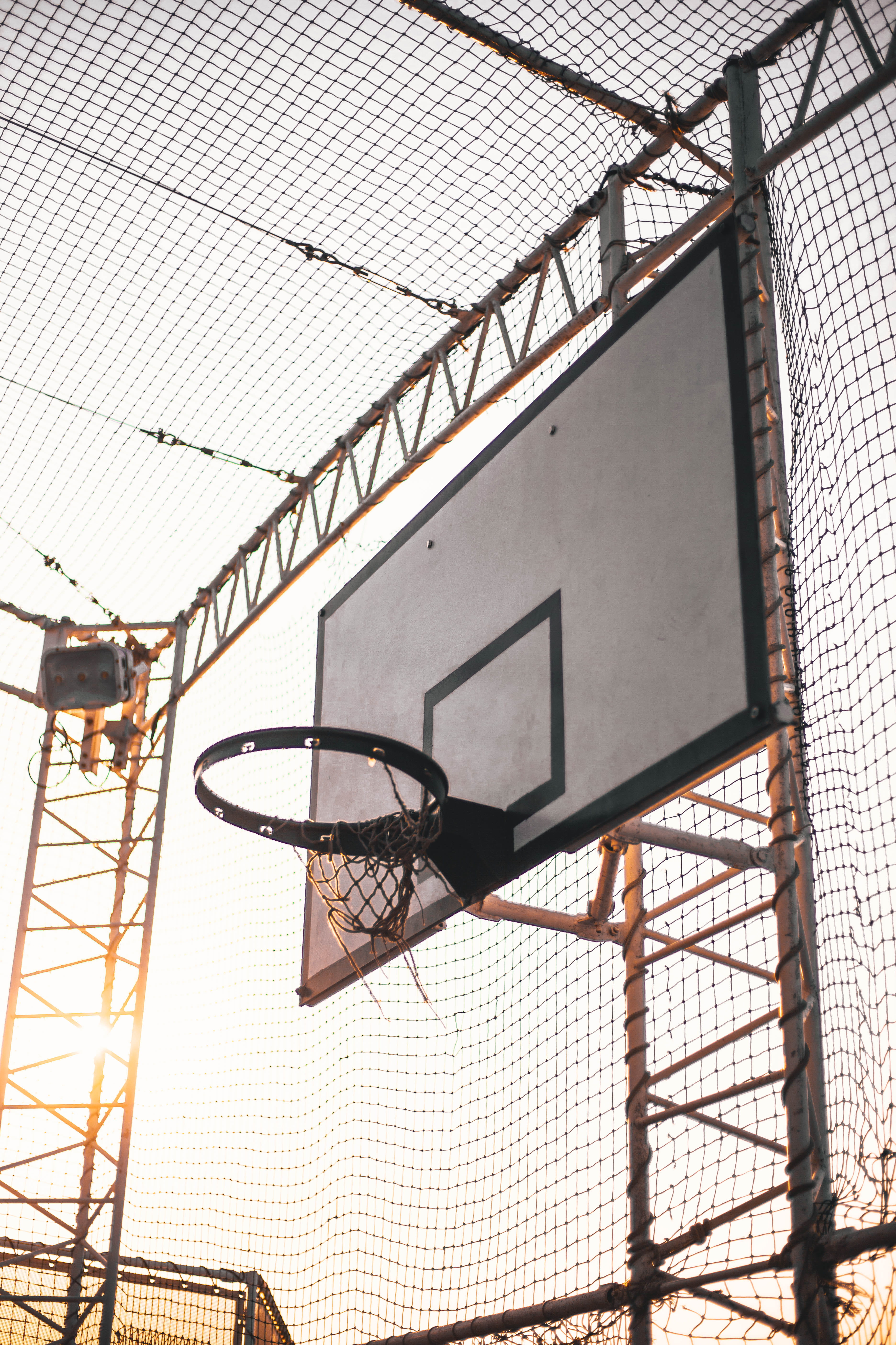team sport, ceiling, outdoors, alone, basketball - sport, 5K, wind, covered, sun light, metal, construction crane, sky, sunshine, old, light, hoop, inside, Phone HD Wallpaper