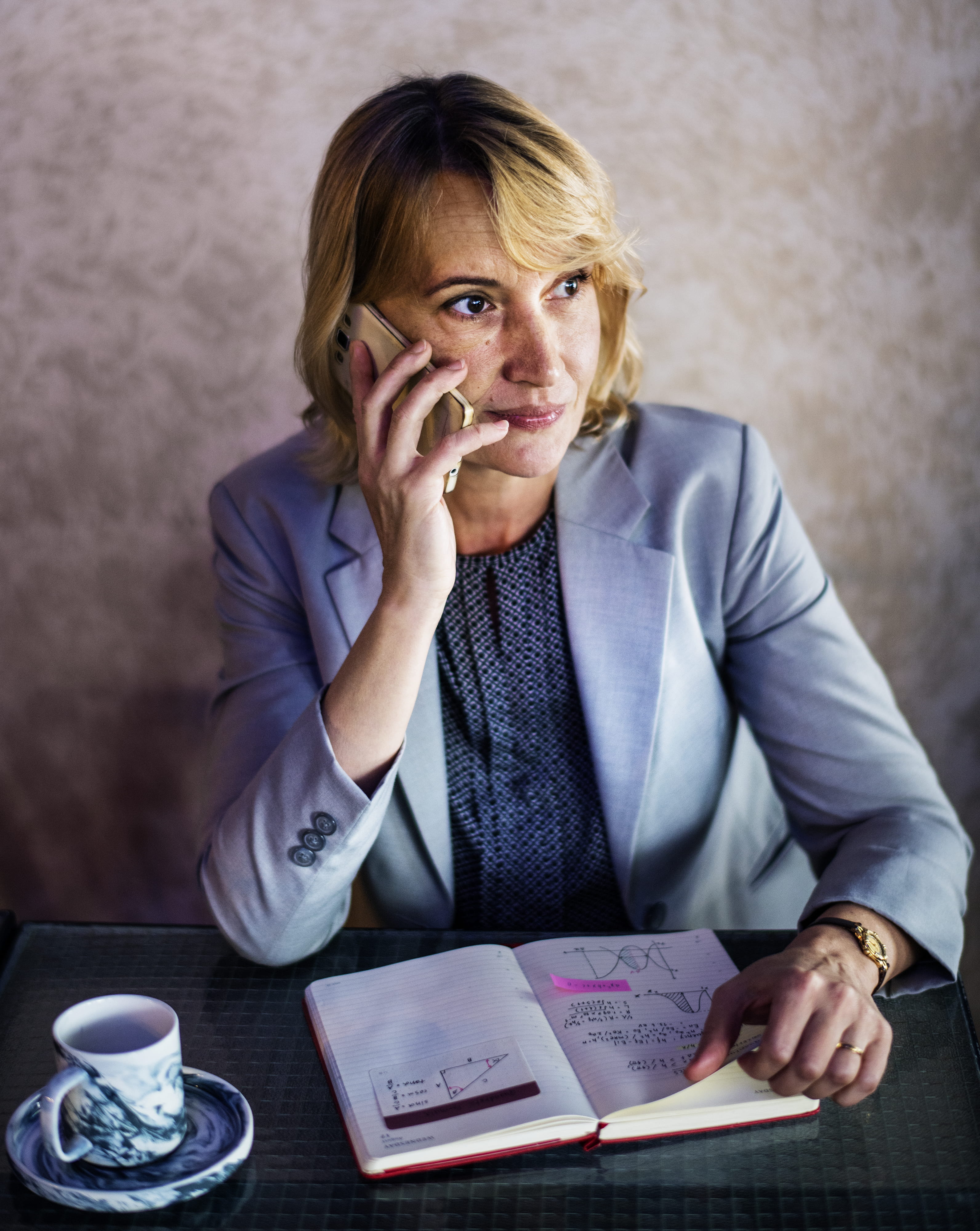 american, calling, sitting, notes, furniture, female, portrait, women, caucasian, digital device, table, mug, notebook, front view, coffee cup, businesswoman, Phone HD Wallpaper