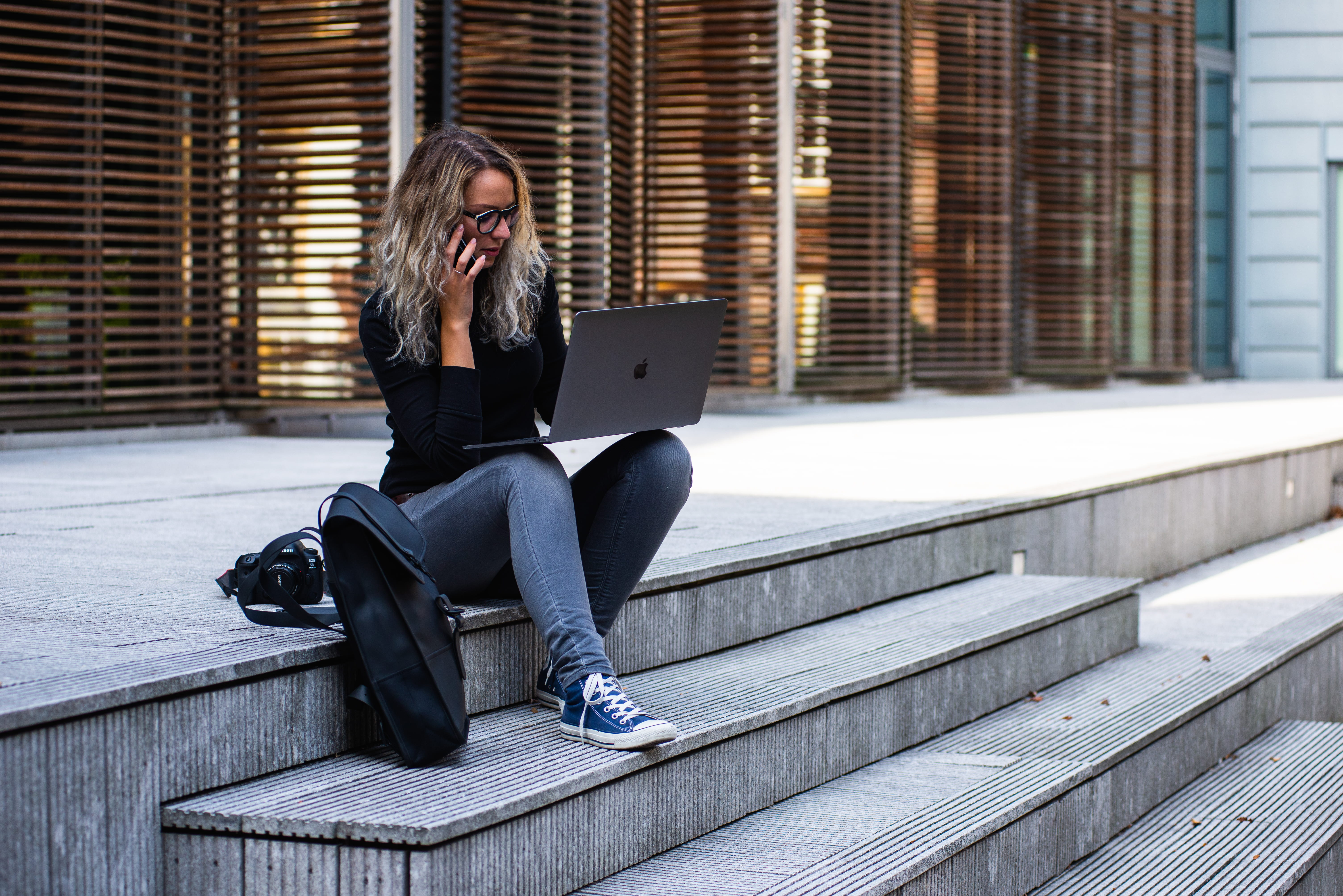 portability, using laptop, portable information device, mobile phone, casual clothing, laptop, step, macbook pro, street, 5K, architecture, sitting, young adult, HD Wallpaper