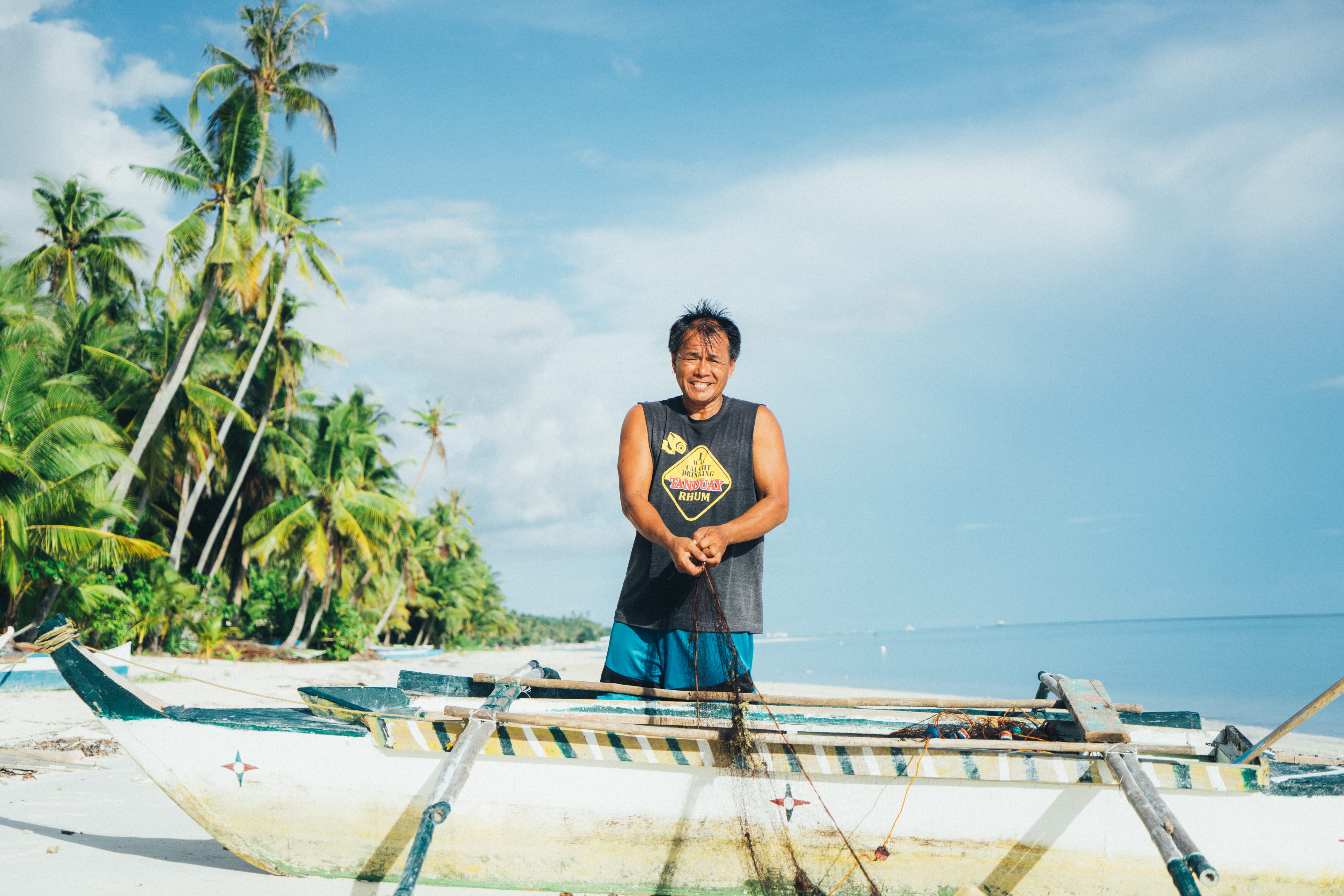 rhum, seashore, fisherman, canoe, rope, beach, day, man, adult, portrait, full length, standing, cloud - sky, sky, emotion, holding, 5K, young adult, nature, HD Wallpaper