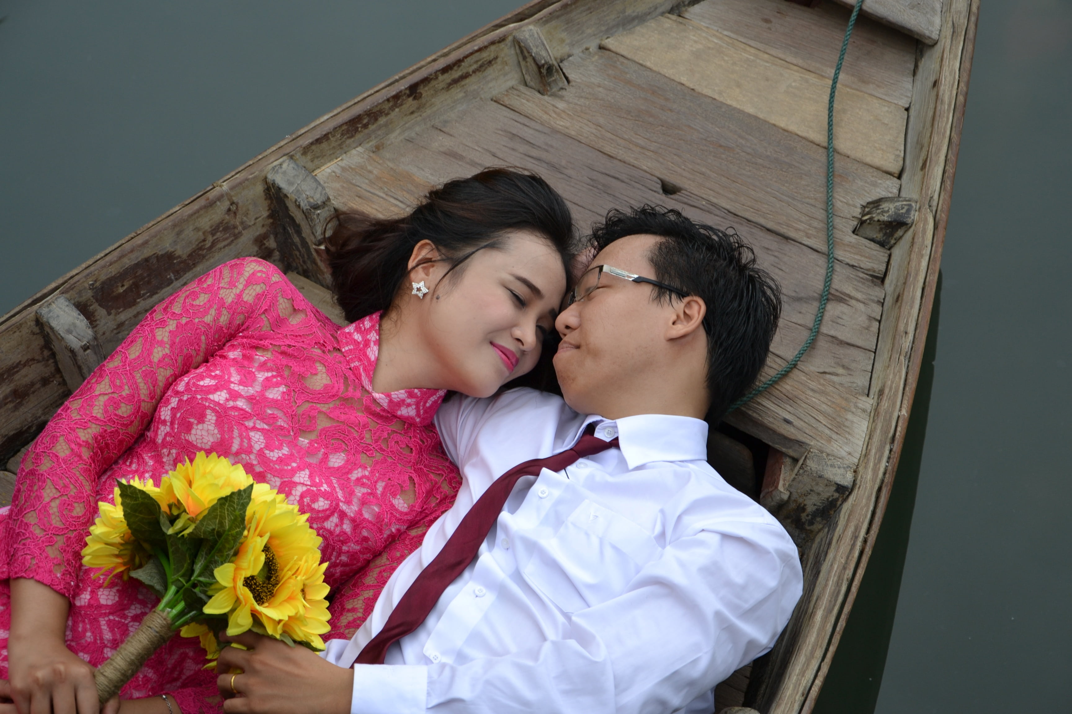 heterosexual couple, people, brown, young men, young women, flower, adult, romance, bouquet, wedding, woman, boat, lying, grooms, bonding, plant, men, romantic, HD Wallpaper