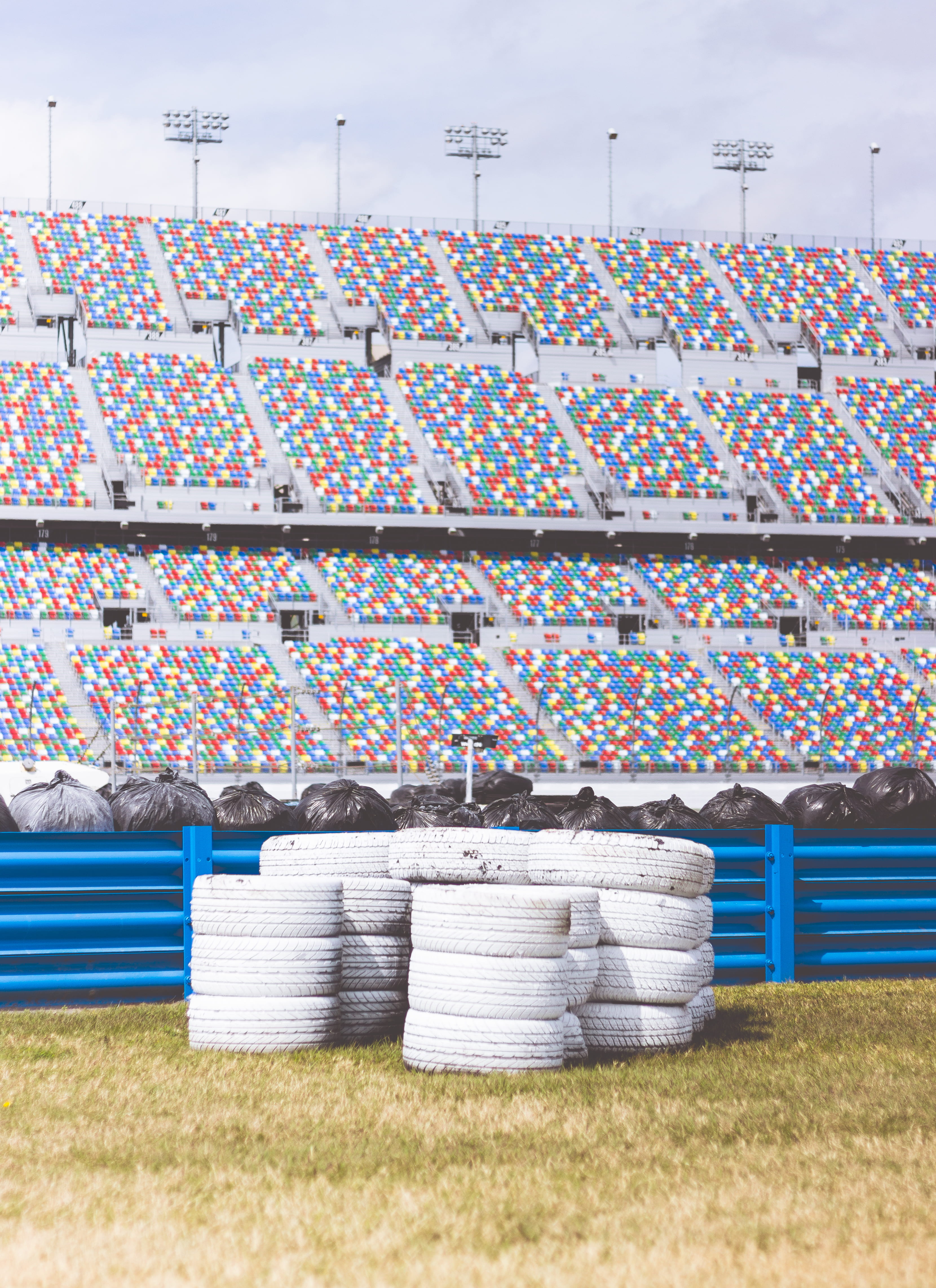 tires, built structure, inside, no people, barrier, nature, stacks, multi colored, empty, large group of objects, day, bootcamp, speedway, abundance, daytona, Phone HD Wallpaper
