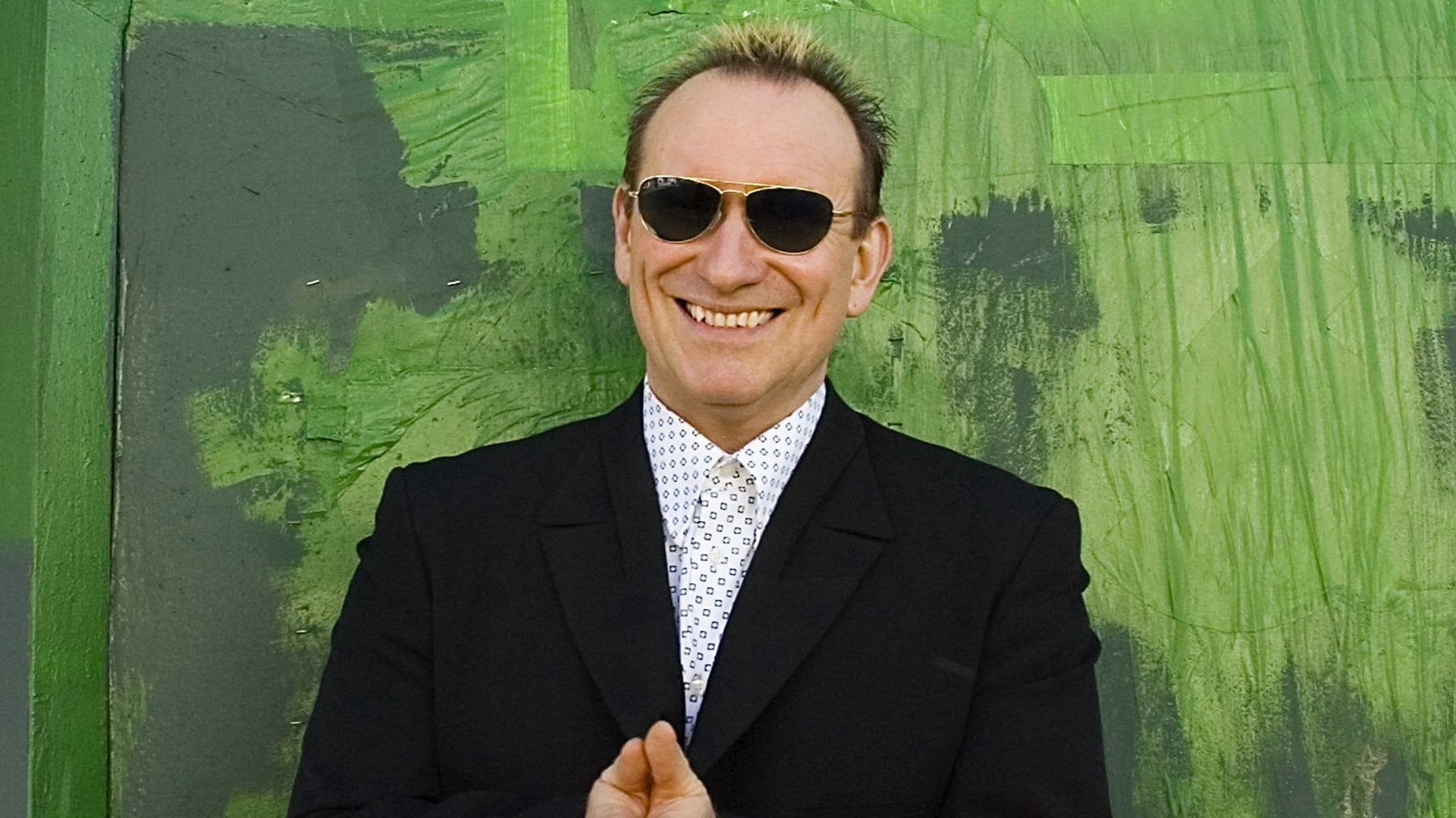 peaked, one person, colin hay, lifestyles, suit, smile, looking at camera, s, black, portrait, mid adult, business, smiling, men, males, jacket, glasses, HD Wallpaper