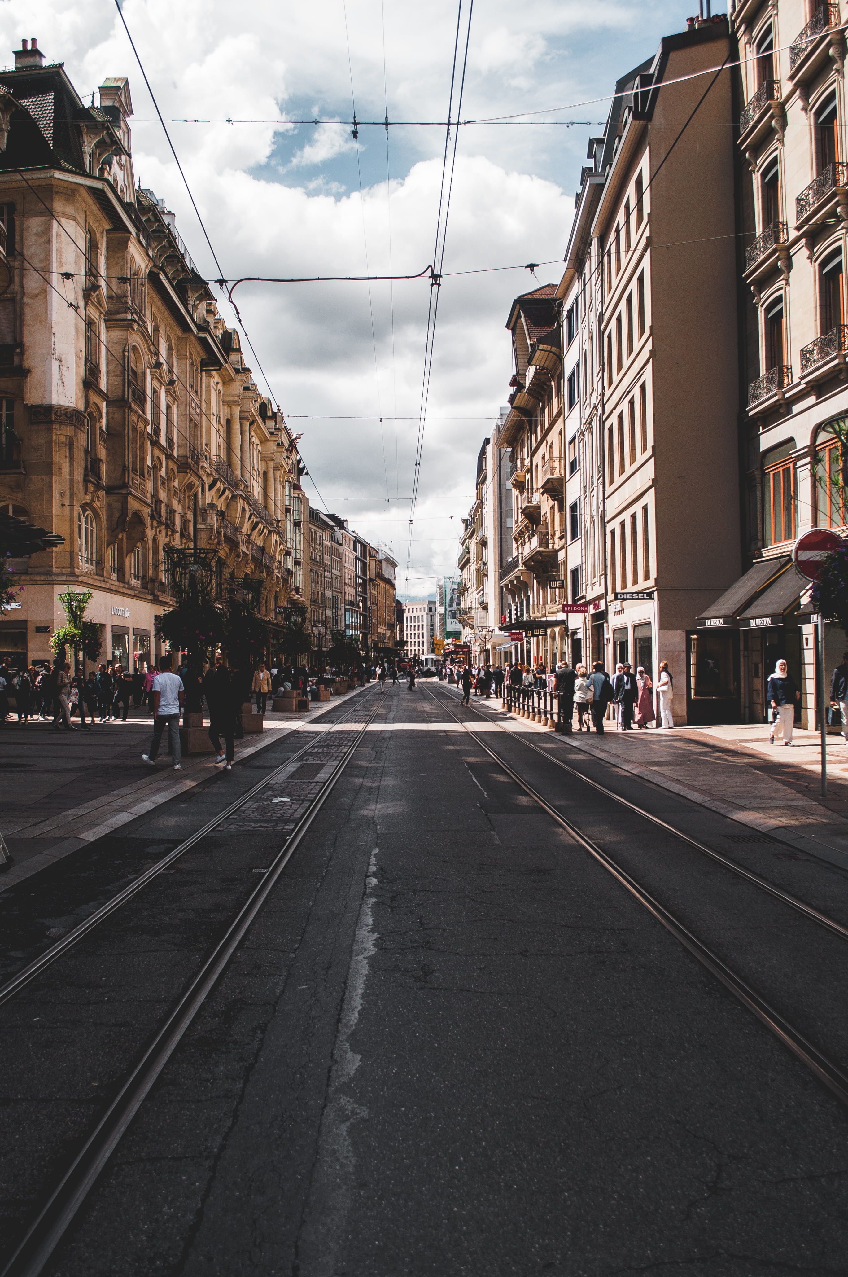 building exterior, concrete, travel, switzerland, tourist, tramline, railroad track, roadside, people, cloud - sky, building, city street, architecture, Phone HD Wallpaper