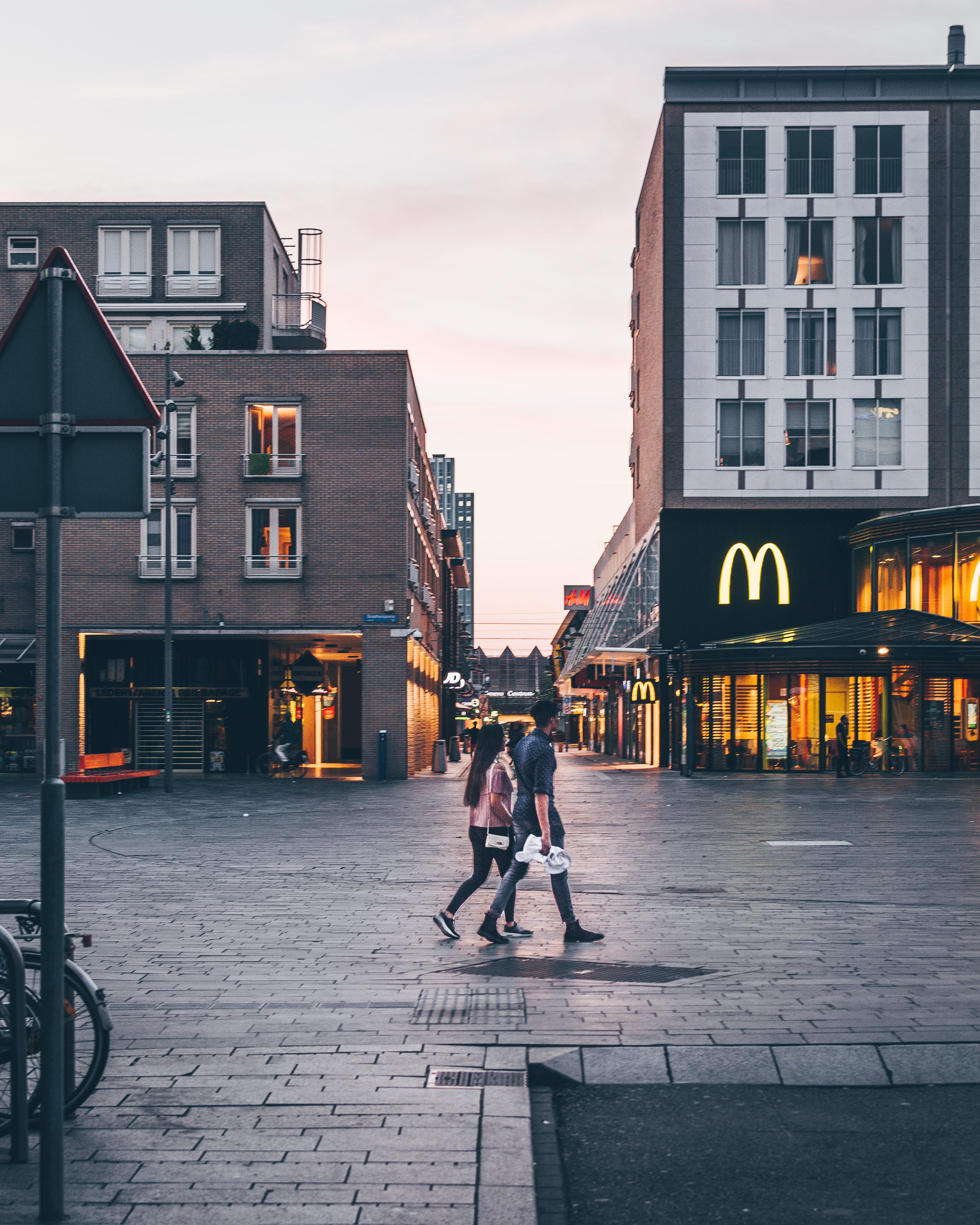 riding, walking, woman, man, building exterior, couple, real people, market, shops, stores, daylight, buildings, building, travel, street, sky, day, leisure activity, Phone HD Wallpaper