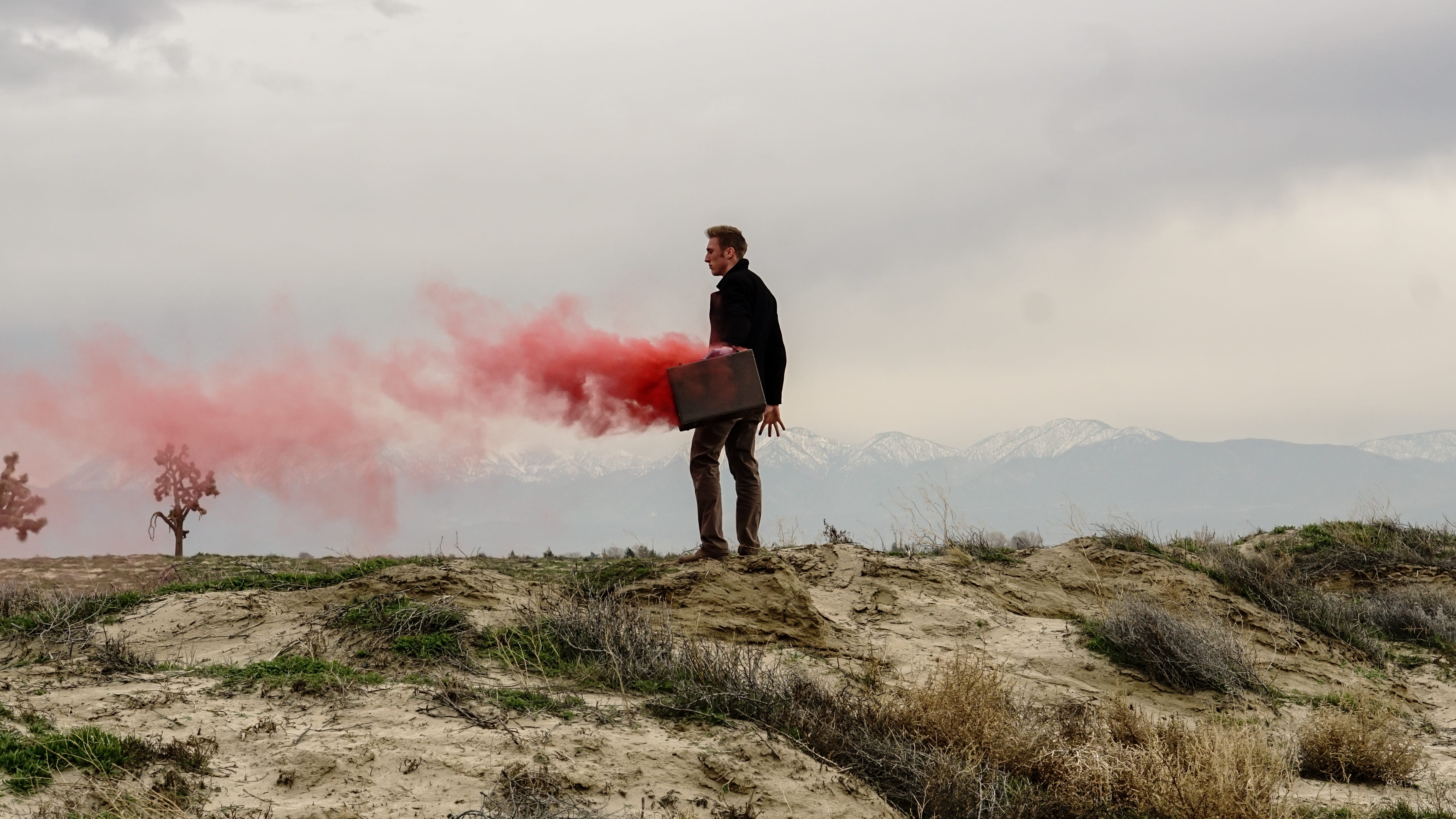 cliff, one person, smoke - physical structure, briefcase, suit, mountain, standing, business, red, environment, full length, day, man, men, smoke, edge, HD Wallpaper