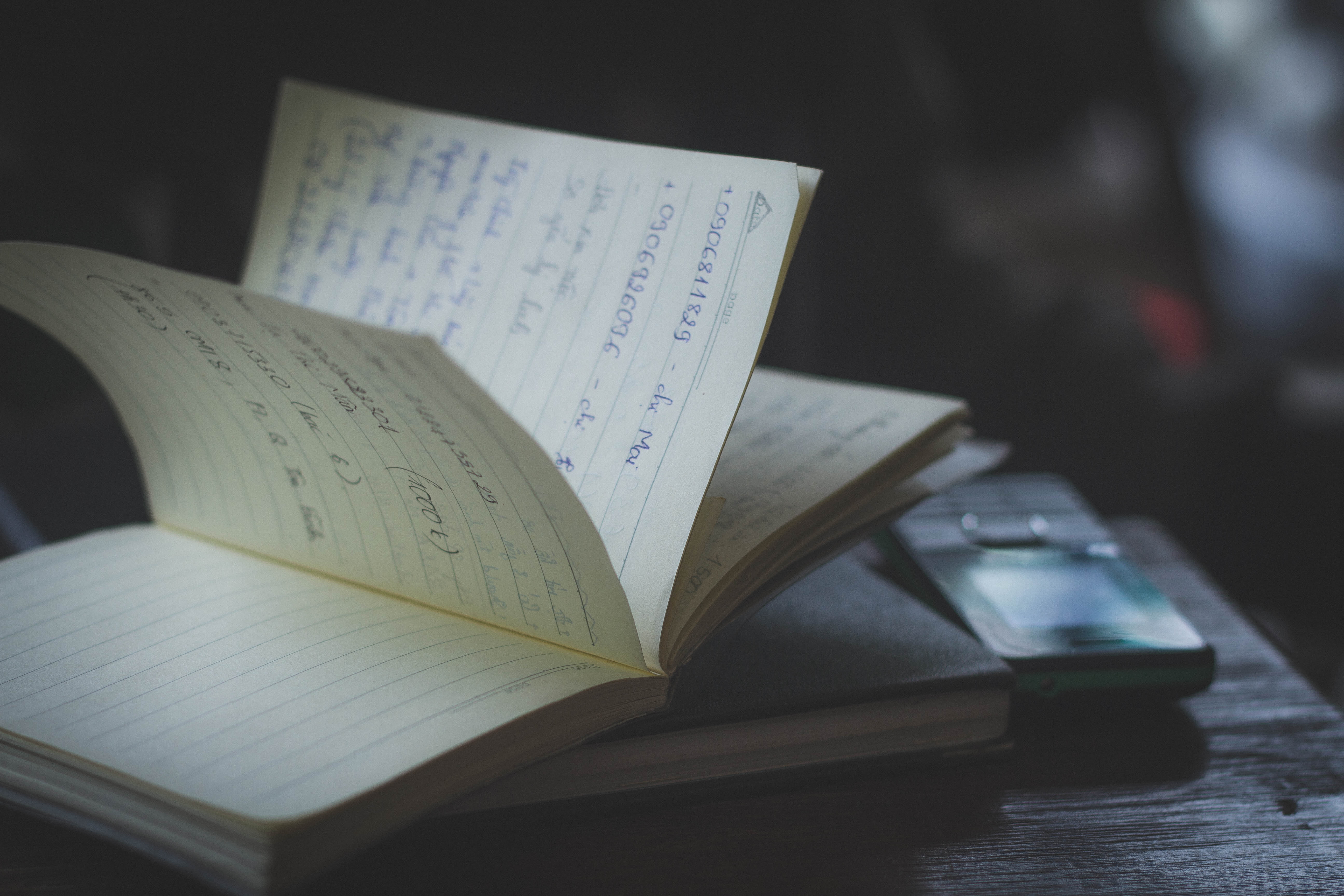 absence, document, indoors, mobile phone, focus on foreground, note, dark, literature, 5K, table, no people, learning, expertise, book, page, blur, still life, HD Wallpaper