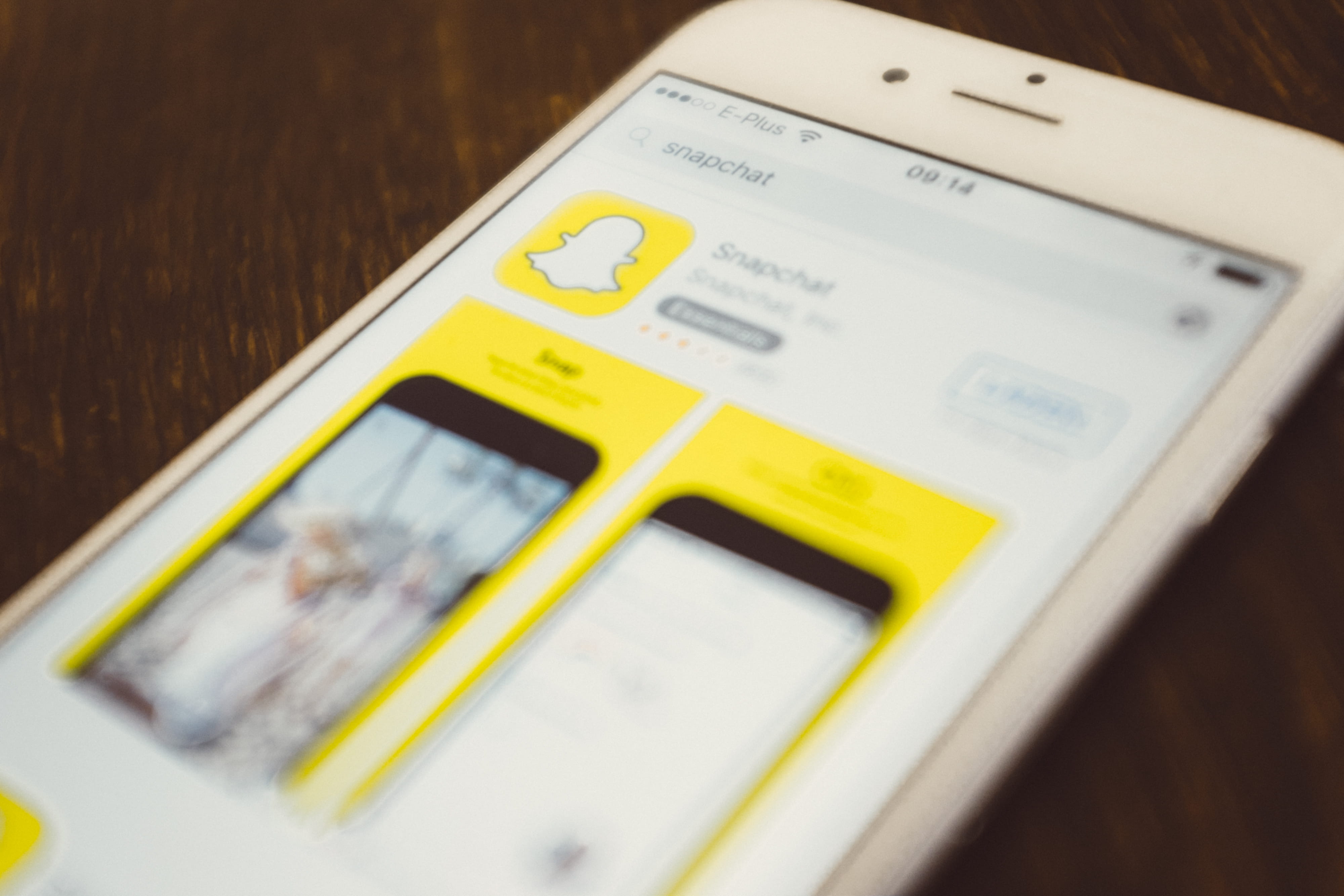 Snapchat, telephone, smart Phone, no people, studio shot, selective focus, close-up, indoors, wood grain, table, application Software, still life, yellow, HD Wallpaper