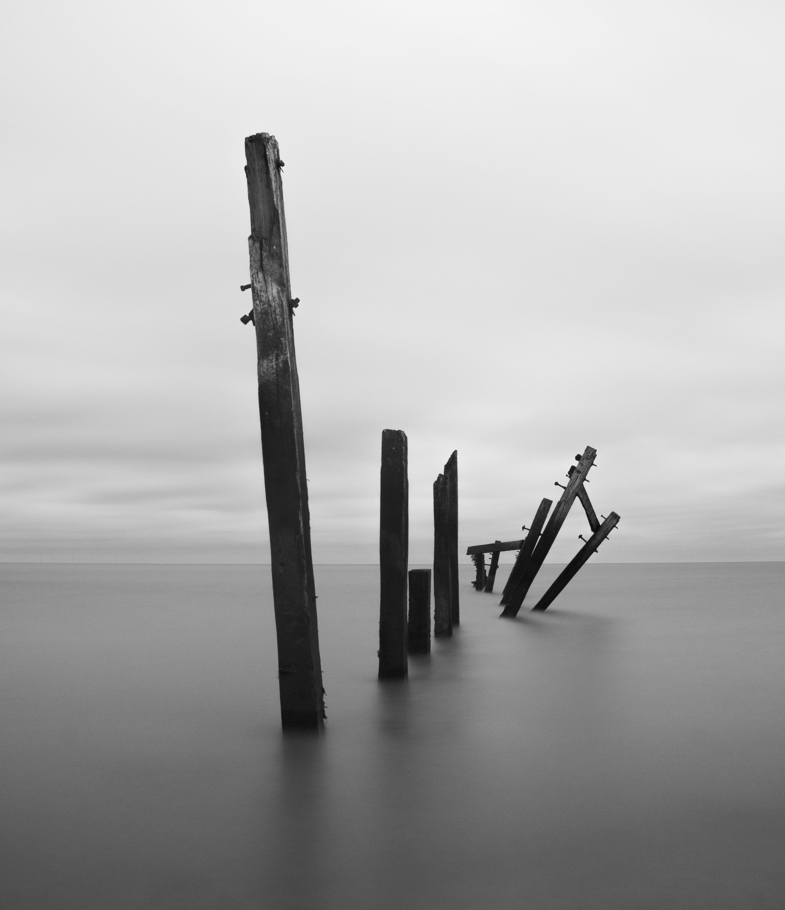 water, nature, tranquil scene, broken, battered, sea, fog, no people, minimal, scenics - nature, day, grey, decay, wood - material, coastal defence, post, Phone HD Wallpaper