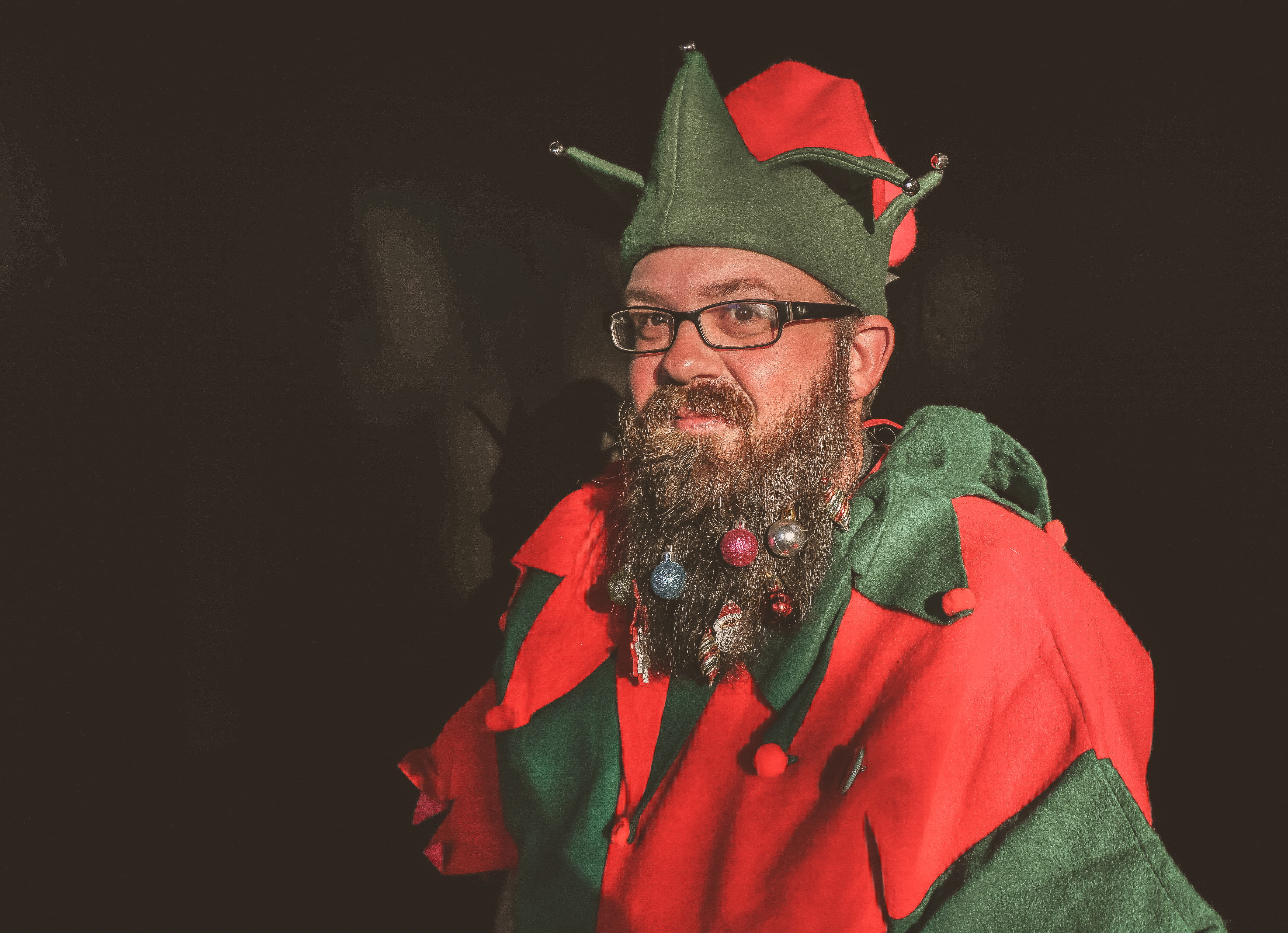 elf, facial hair, eyeglasses, males, portrait, person, room, hair, beard, fashion, costume, ornaments, adult, face, red, lifestyle, christmas balls, photoshoot, HD Wallpaper