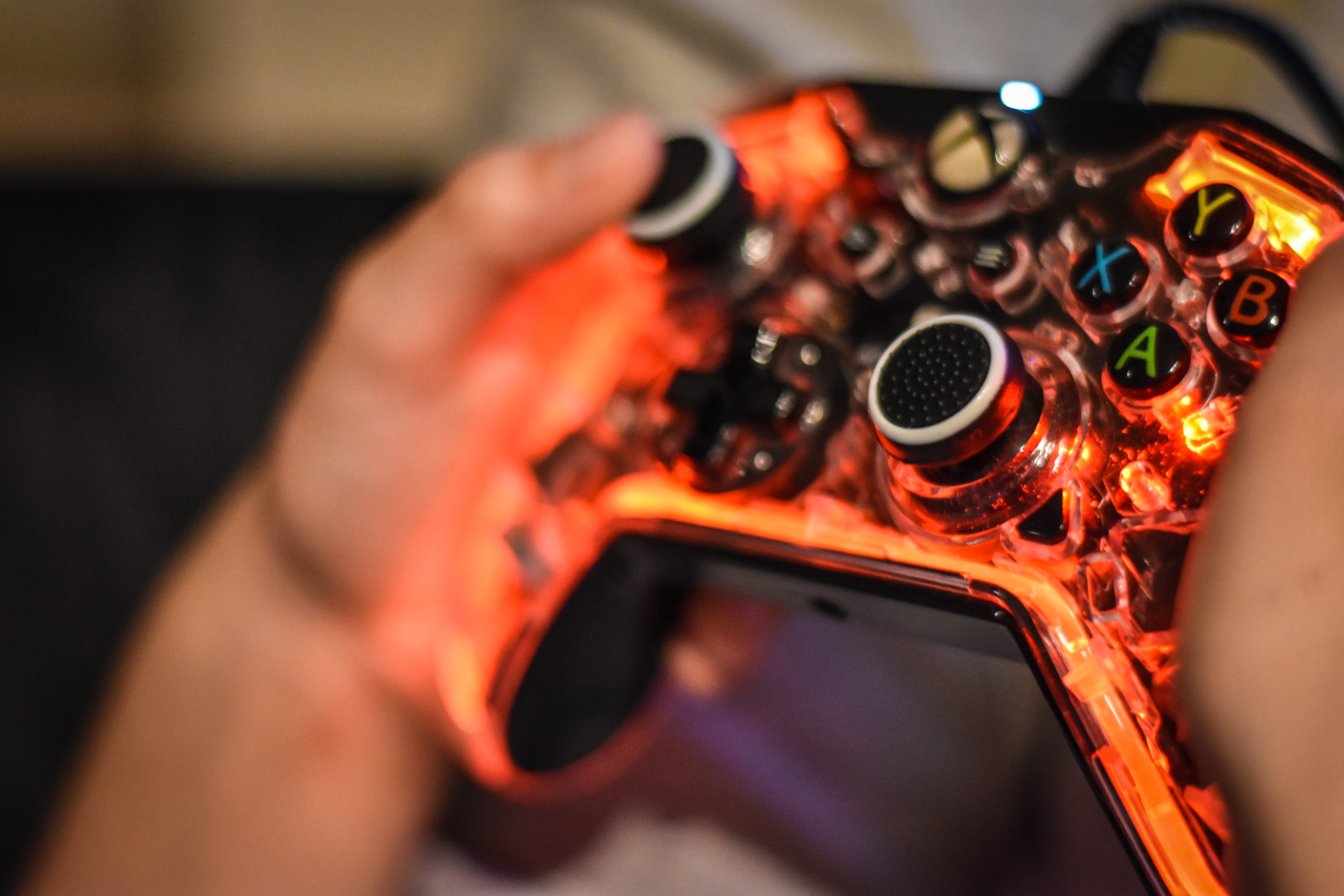 young, 5K, adult, xbox, gaming, led, occupation, weapon, human body part, hand, gun, close-up, technology, games, hands, holding, one person, selective focus, HD Wallpaper