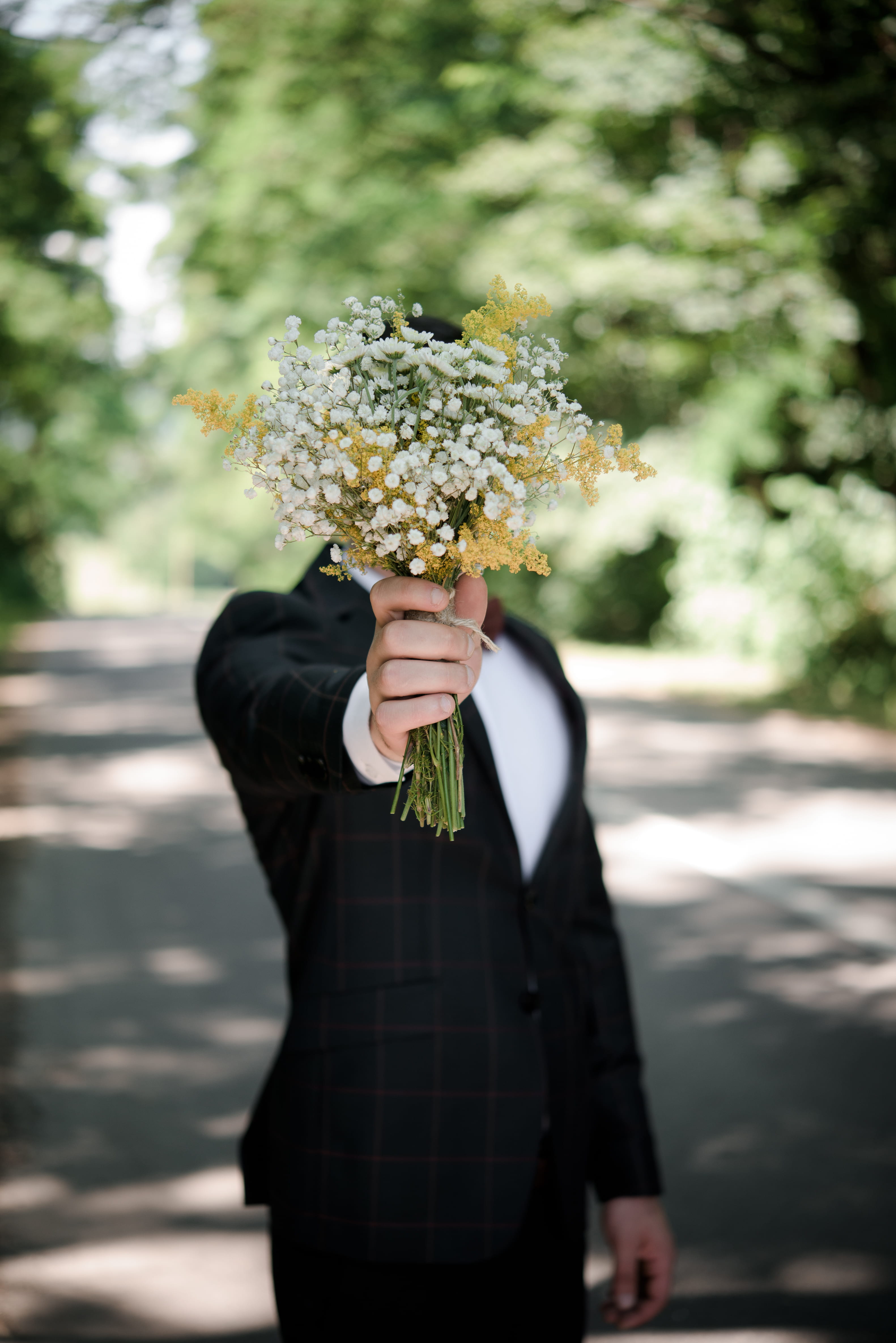 wearing, front, wedding, holding, real people, focus, plant, one person, selective, flowering plant, focus on foreground, groom, freshness, jacket, men, Phone HD Wallpaper