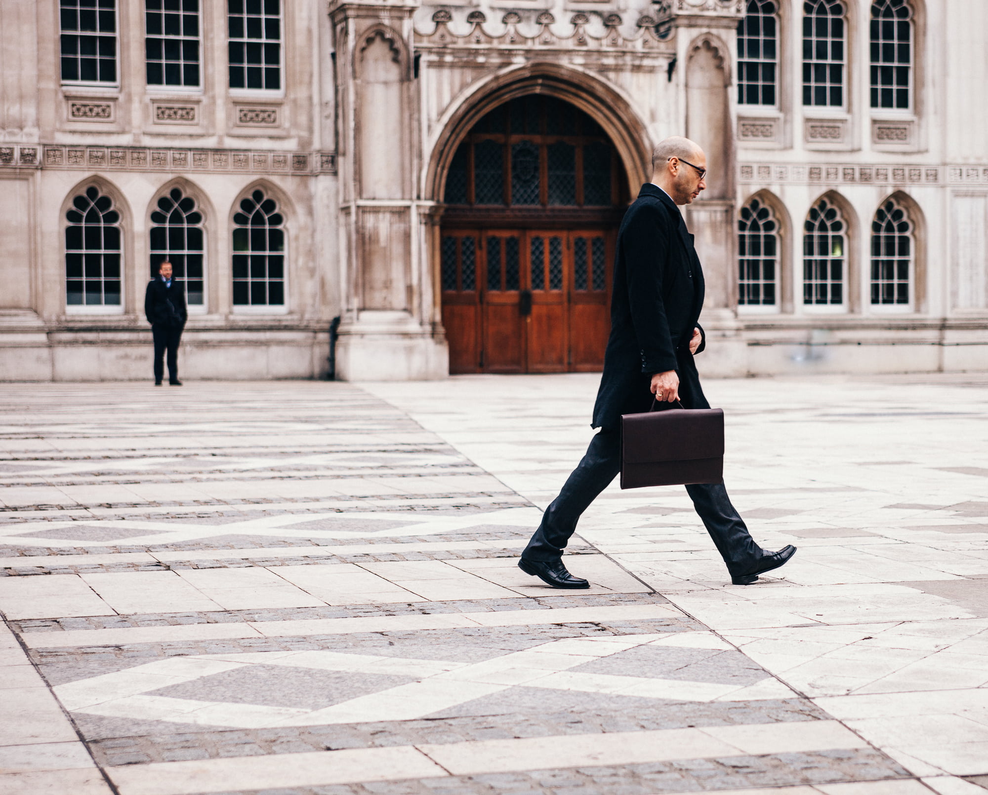 eyeglasses, arch, cityscape, real people, formal coat, doors, city, adult, facade, black shoes, business person, incidental people, outdoors, building exterior, HD Wallpaper