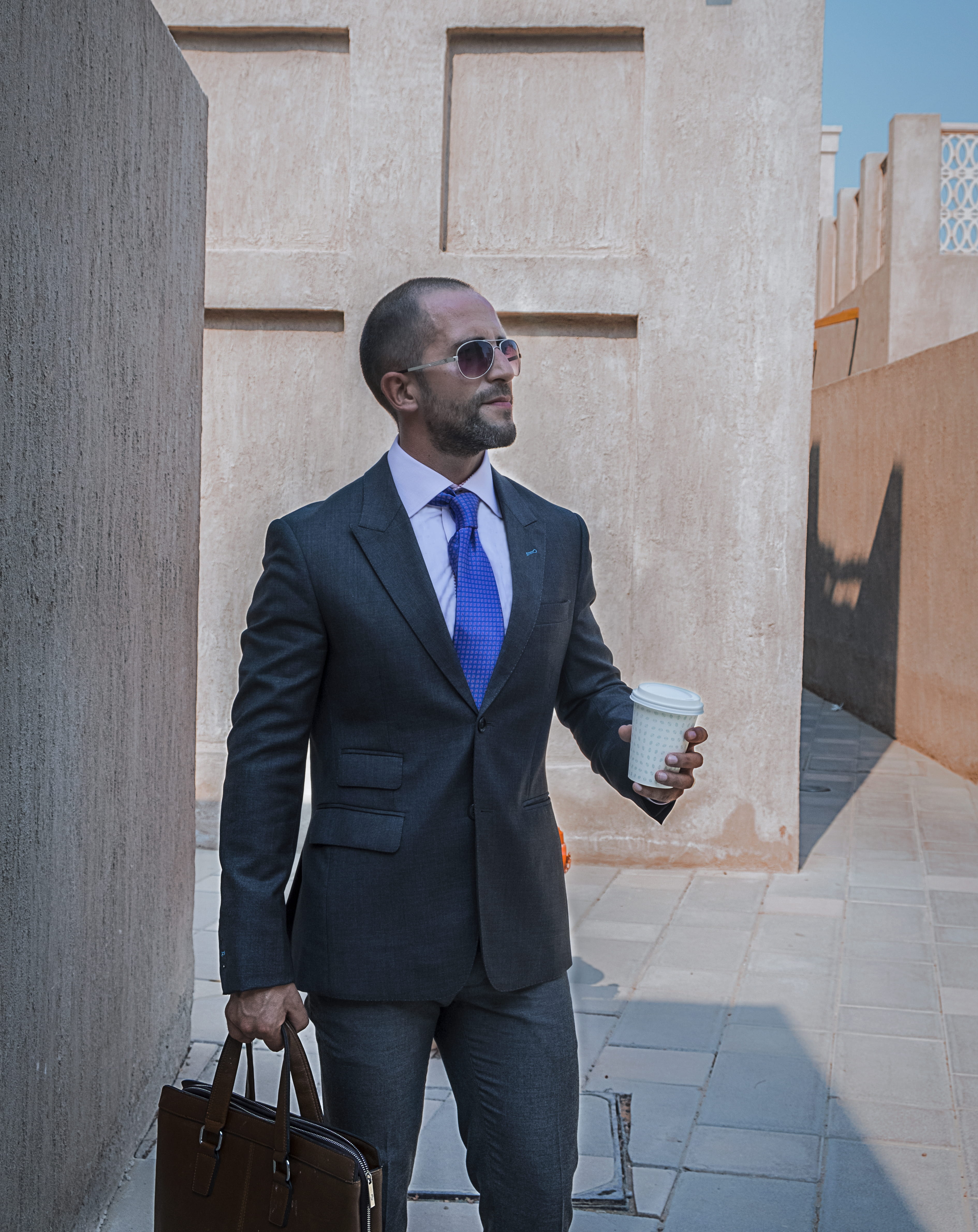 front view, formalwear, daytime, walls, outdoors, one person, men, coffee drink, wear, modern, holding, standing, well-dressed, real people, formal, gentleman, Phone HD Wallpaper