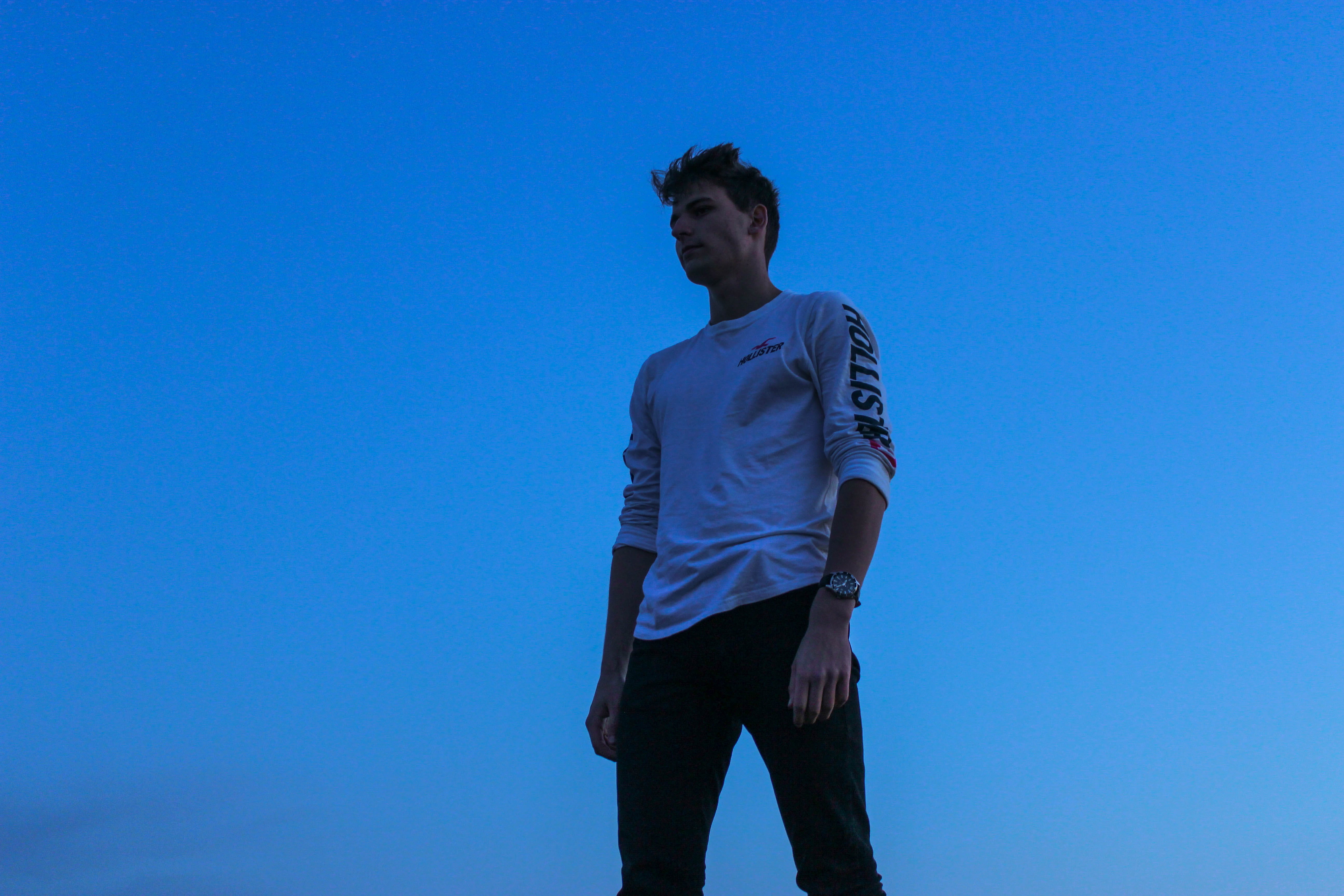 three quarter length, sky, human, colorful, standing, copy space, young adult, minimalism, contemplation, shorts, nature, person, travel, one person, day, HD Wallpaper
