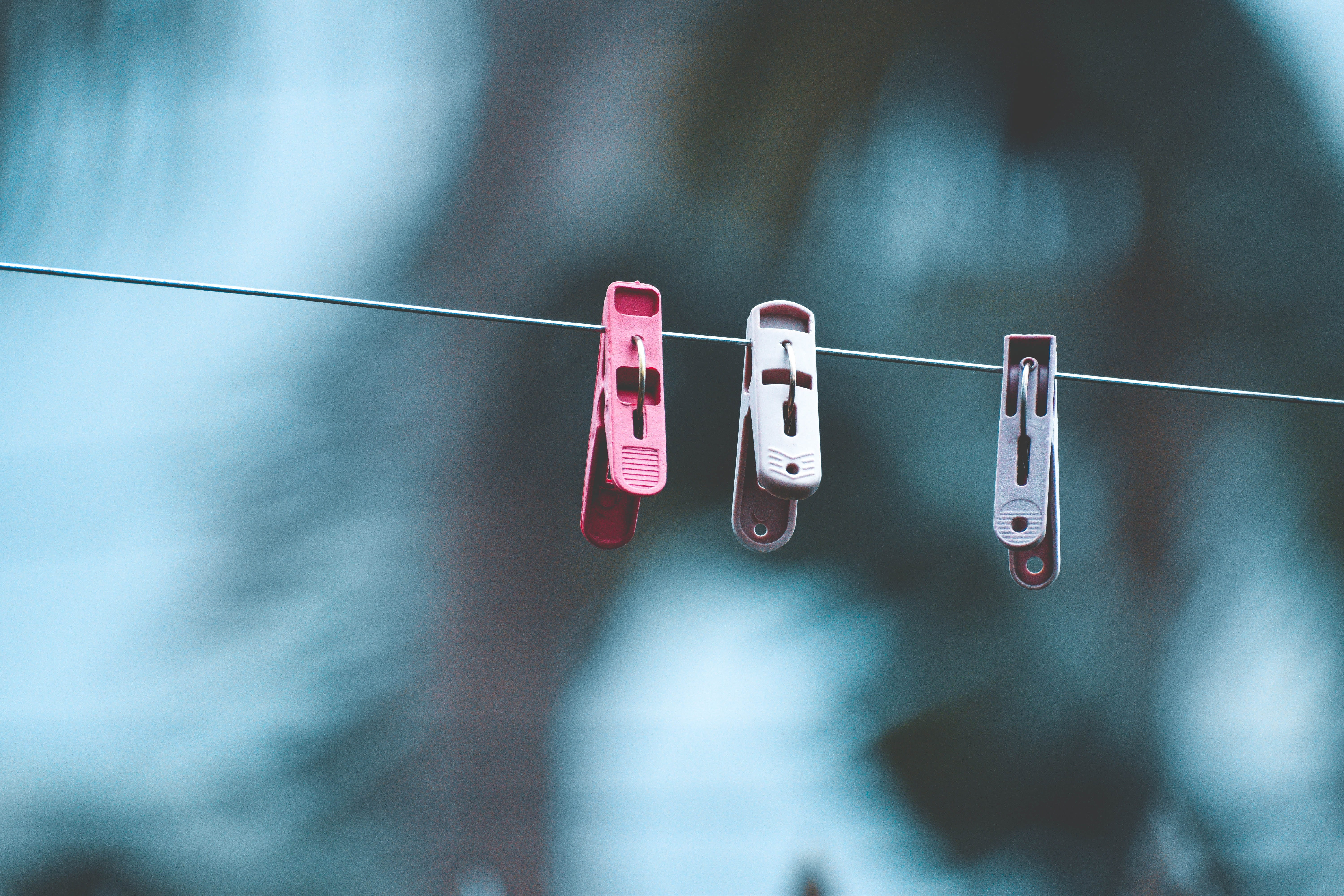 clothing, clothespins, three, hanging, still life, clothespin, low angle view, line, nature, clothesline, group of objects, close-up, no people, focus, HD Wallpaper