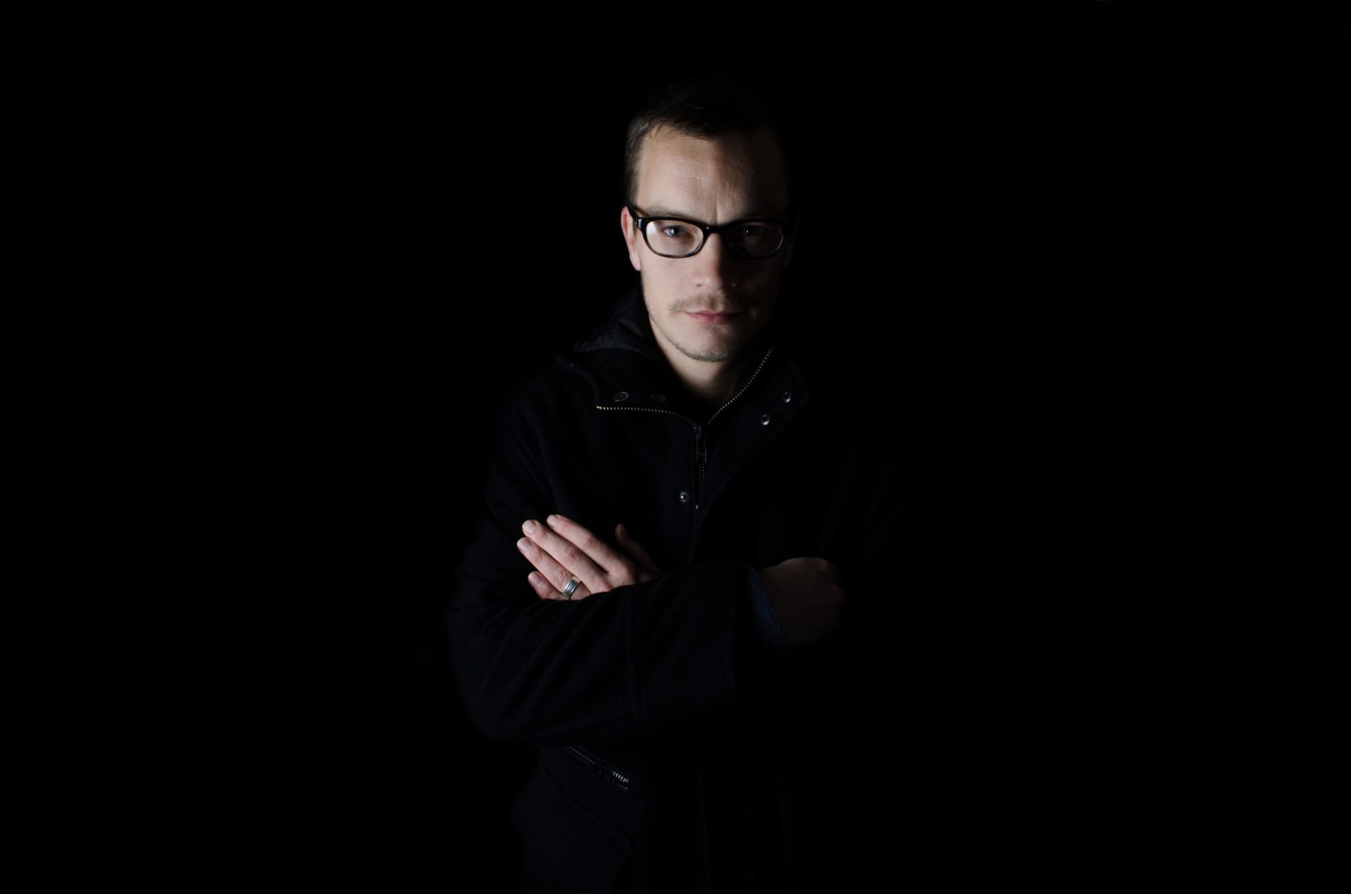 black background, one person, glasses, black, adult, front view, face, think, young men, man, indoors, portrait, teenager, skin, looking at camera, shadow, HD Wallpaper