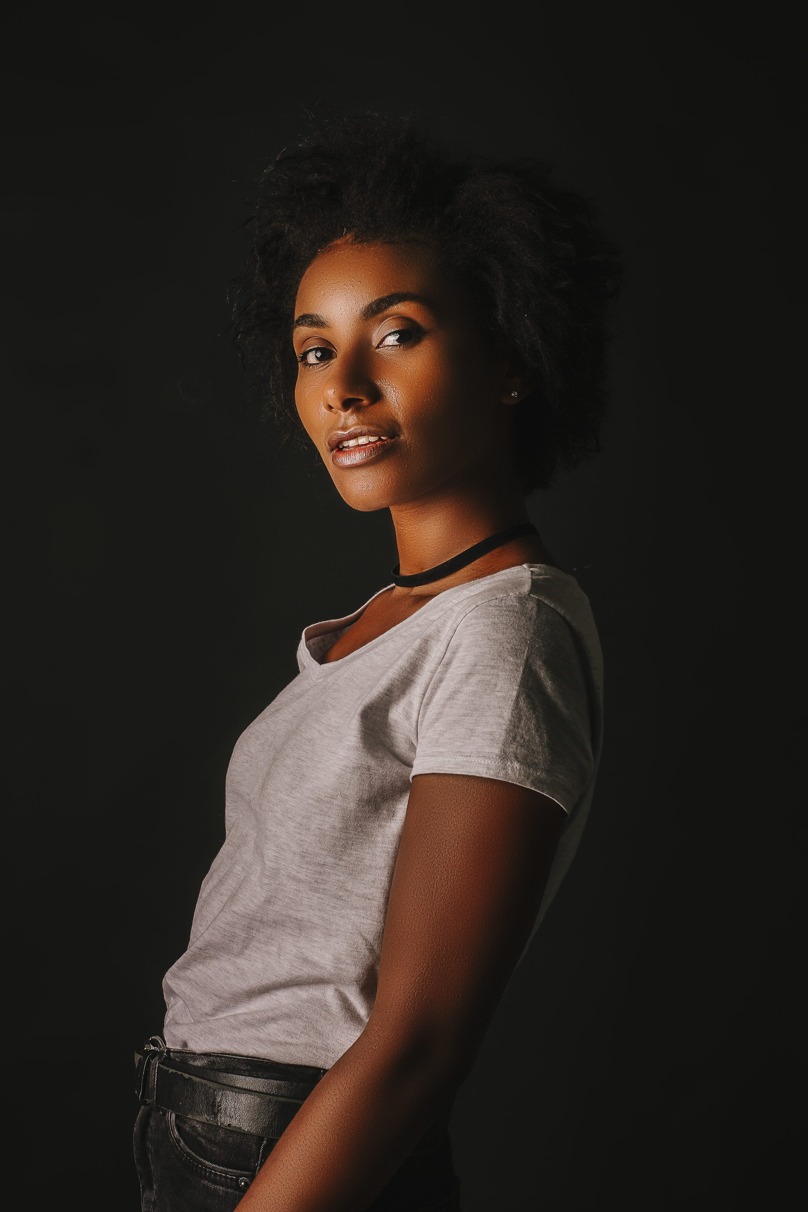 indoors, shirt, adult, smiling, black background, hair, lifestyles, studio shot, standing, women, portrait, young adult, t, dark, looking at camera, background, Phone HD Wallpaper
