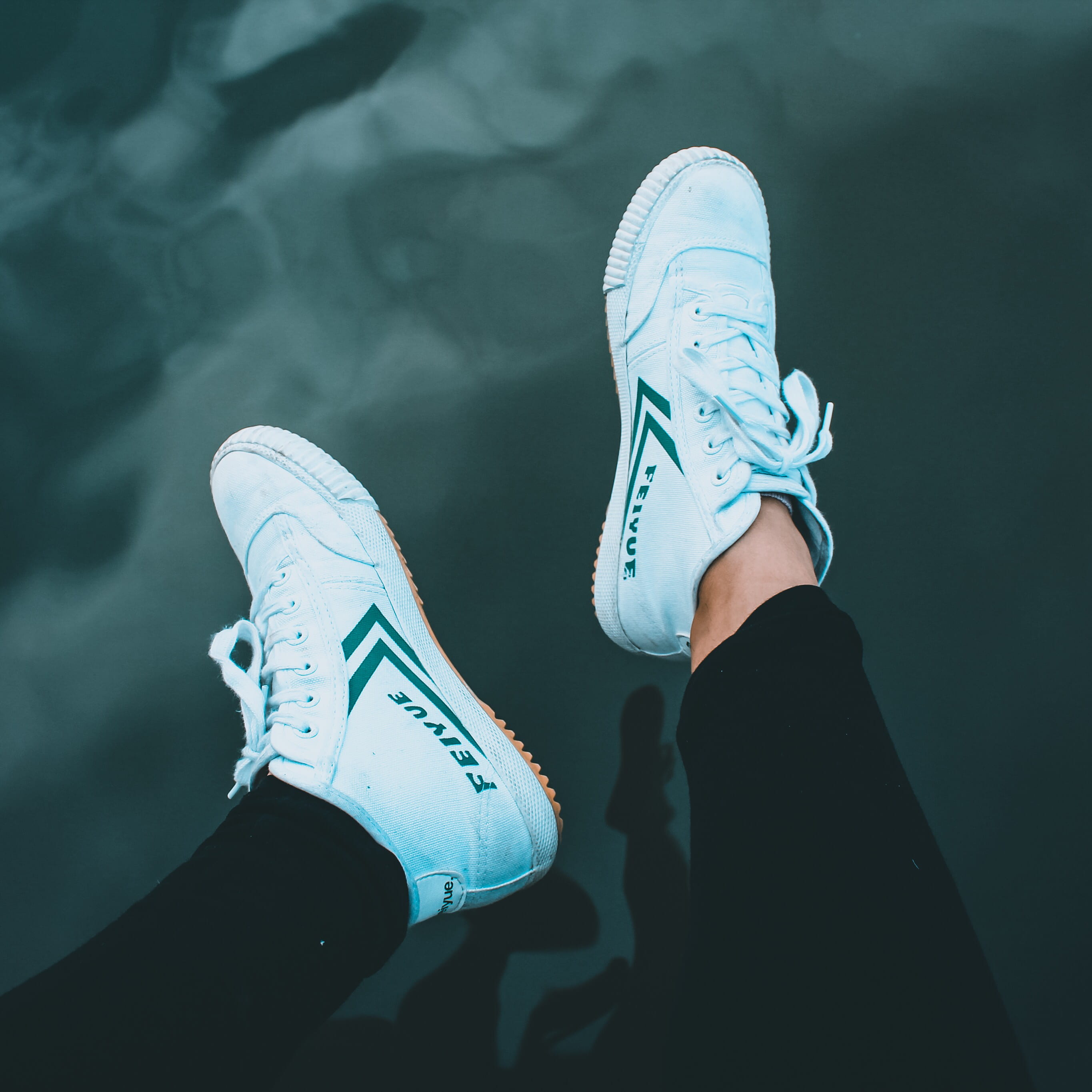 human limb, feet up, water reflection, reflection, 2K, feiyue, high angle view, human leg, clothing, high top, fashion, men, top, lake, green, body part, Phone HD Wallpaper