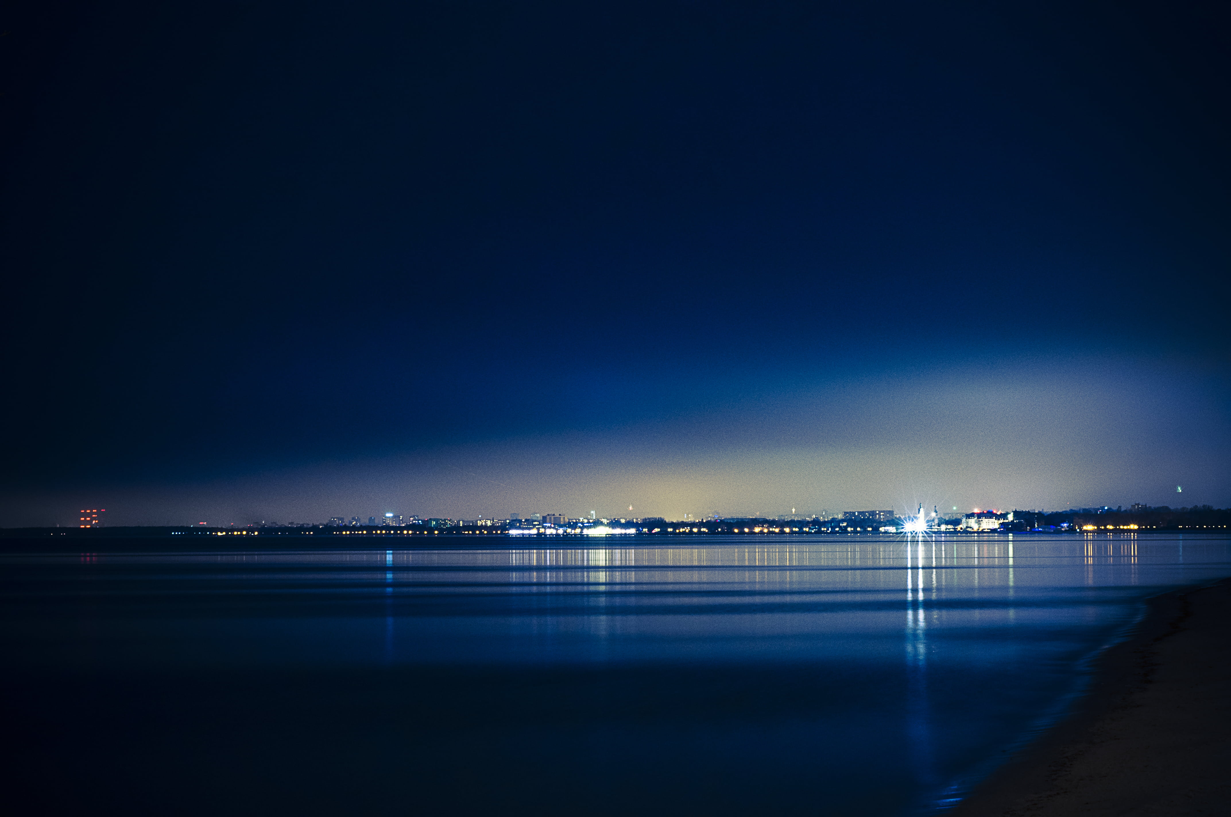 sky, scenics - nature, night, reflection, blue, royalty  images, illuminated, city, lights, beach, outdoors, sea, light, nature, 4K, water, land, copy space, HD Wallpaper