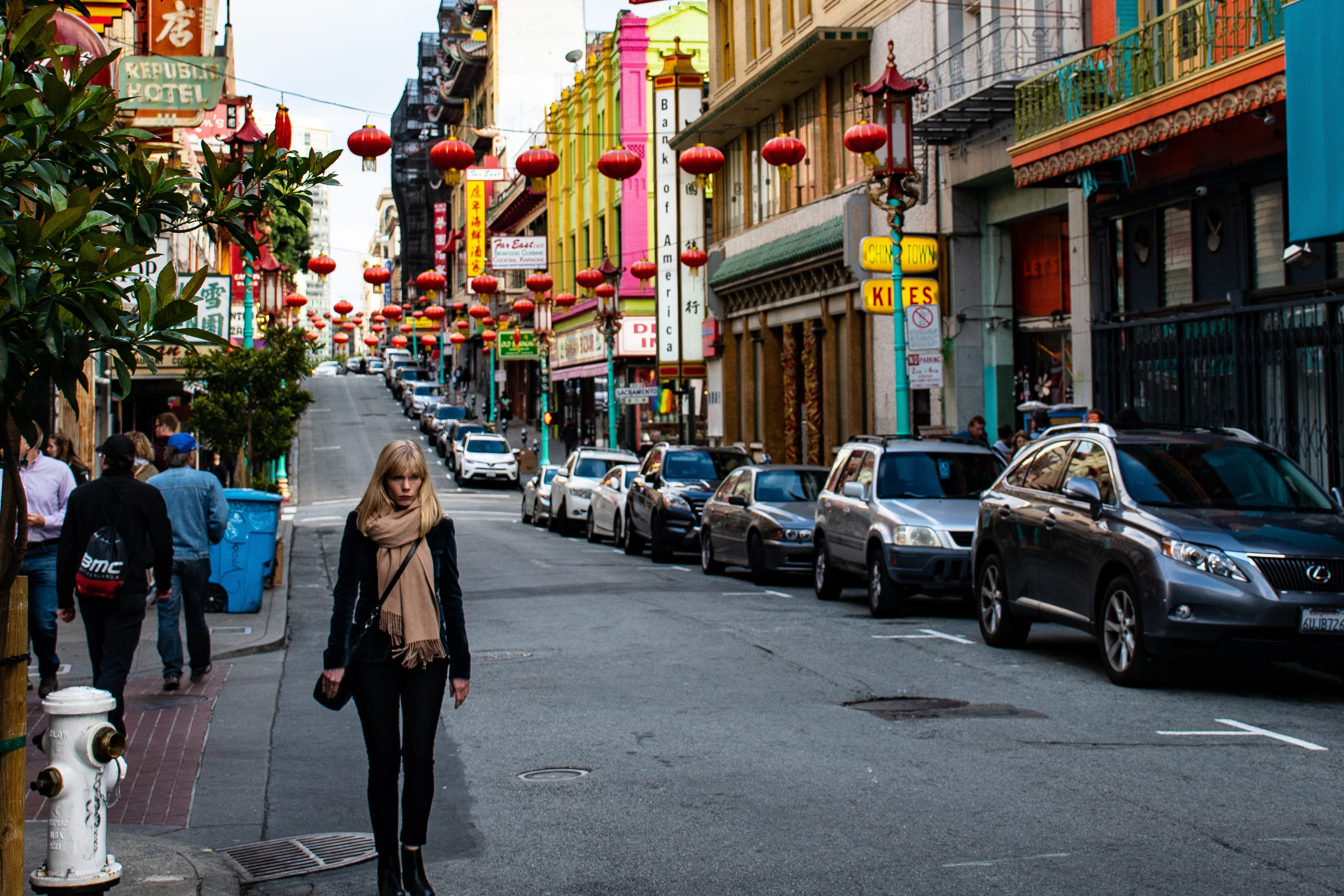 cars, adult, incidental people, land vehicle, shops, car, black, walking, city, outdoors, buildings, city street, transportation system, jacket, daytime, HD Wallpaper