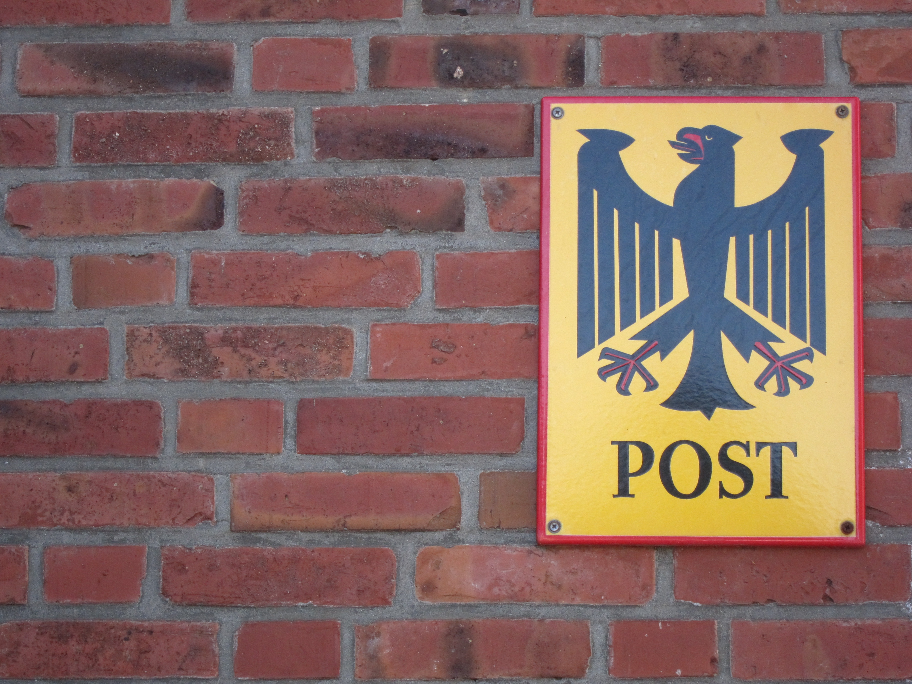 warning sign, telegram, mail carrier, red, federal eagle, text, built structure, yellow, privatization, close-up, human representation, brick wall, sign, HD Wallpaper