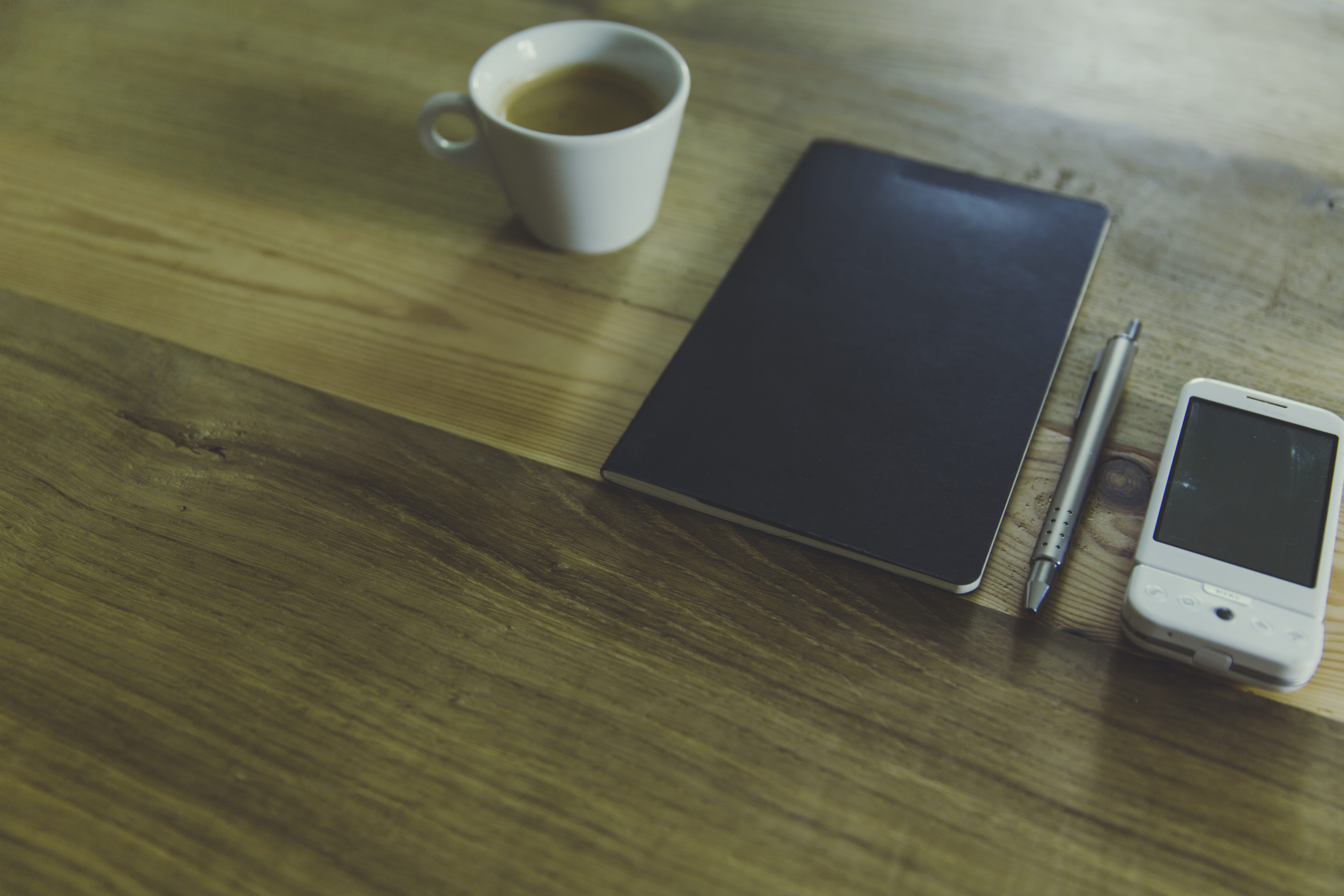 drink, mobile phone, black, white, mug, smart phone, notebook, wood - material, high angle view, beside, indoors, desk, table, coffee - drink, food and drink, HD Wallpaper