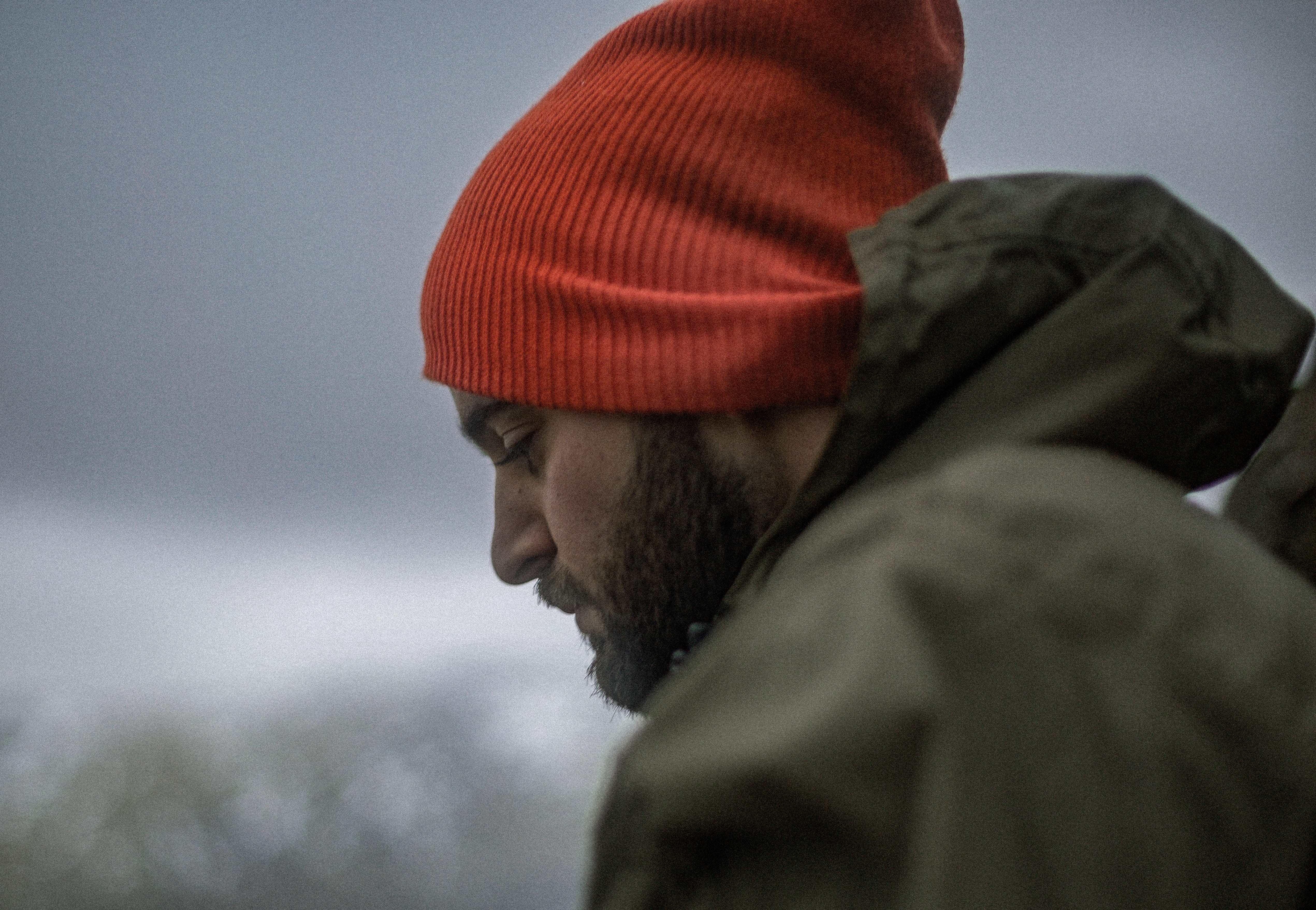 guy, adult, clothing, lake, caucasian, hat, hoodie, looking, warm clothing, wearing, profile view, man, facial hair, red, portrait, males, depression - sadness, HD Wallpaper