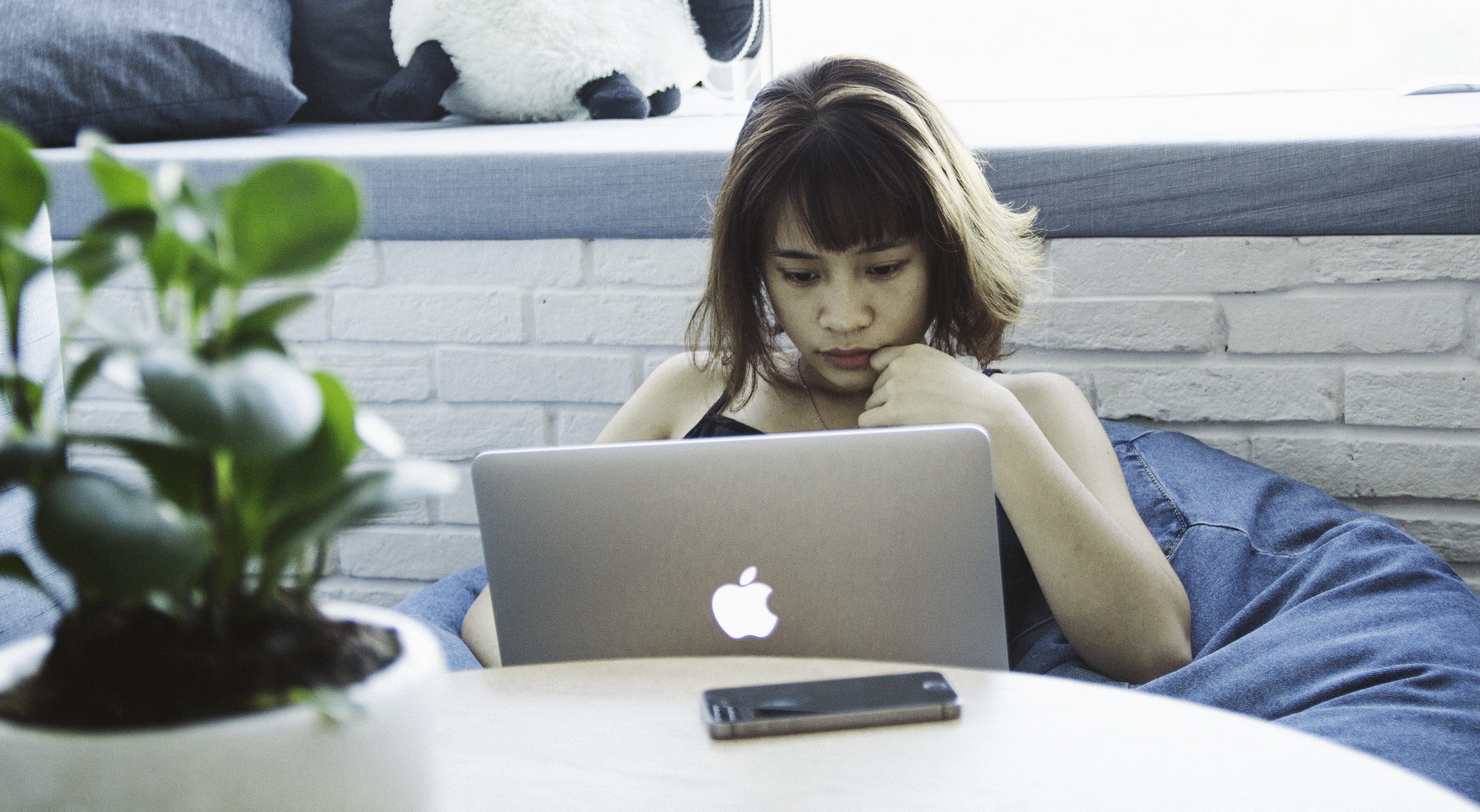 one person, macbook, real people, contemplation, casual clothing, lifestyles, in house, soft, plant, laptop, using laptop, looking, tech, women, macbook pro, HD Wallpaper