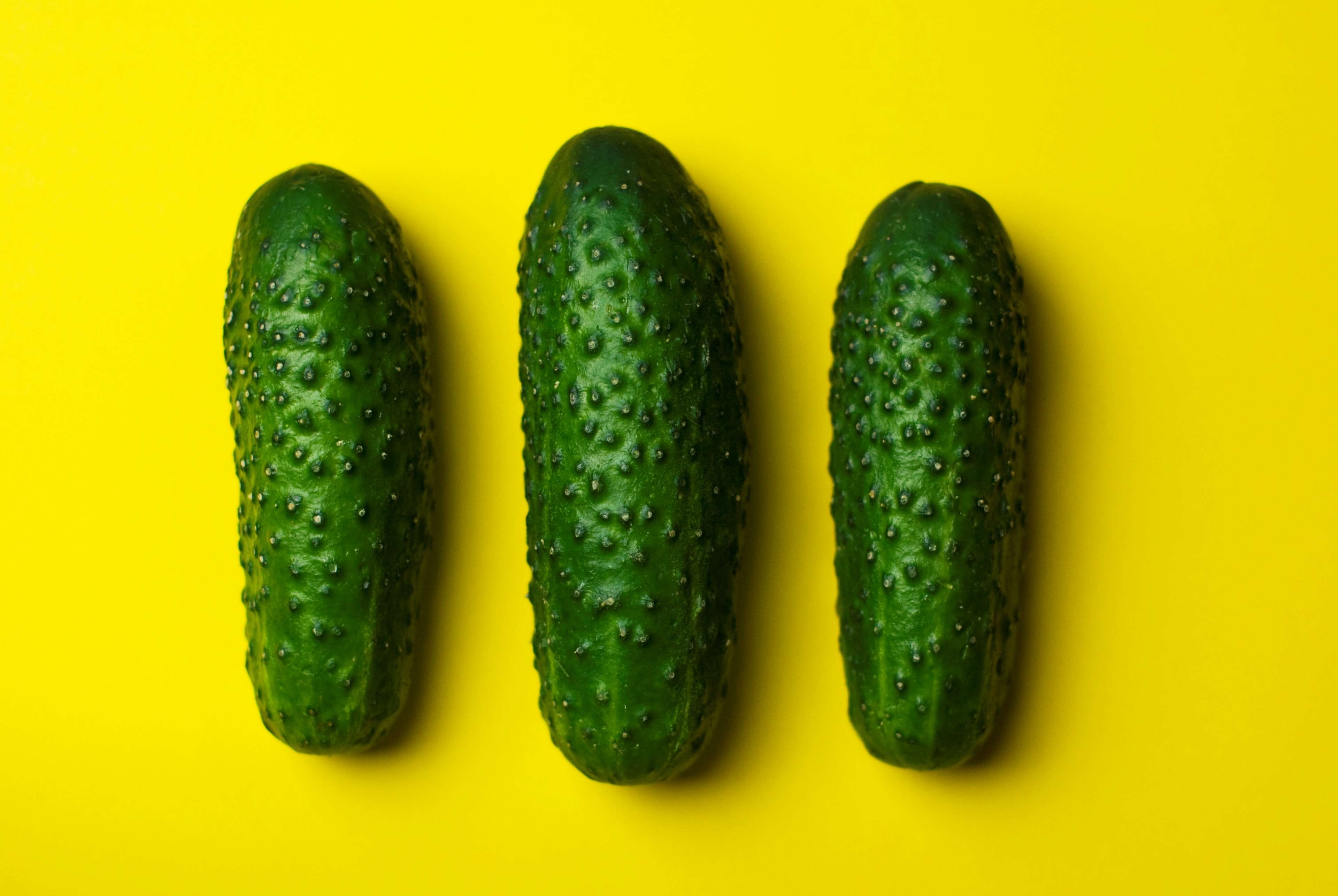 in a row, colored background, three objects, no people, gherkins, close-up, cucumbers, green color, food, indoors, ripe, freshness, studio shot, yellow, HD Wallpaper