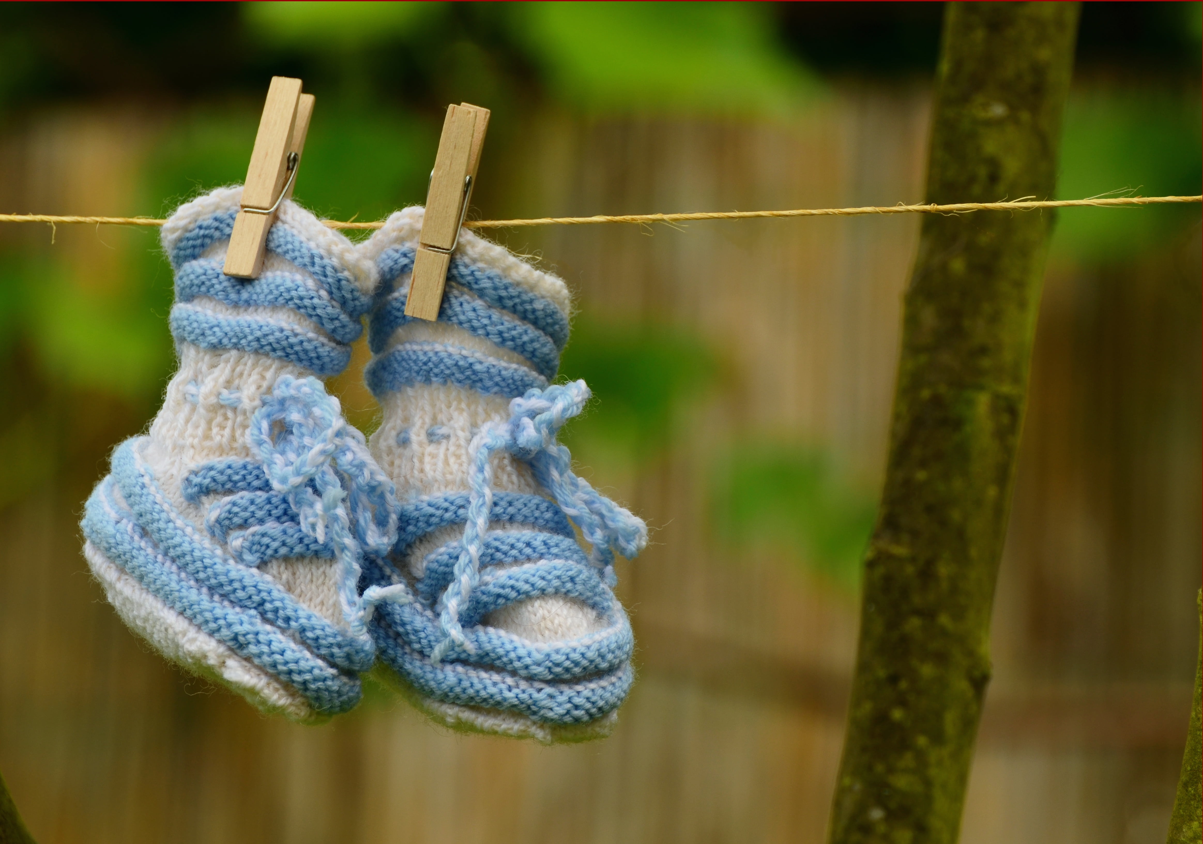 clothing, small child, shoes, wire, selective focus, outdoors, gift, rope, wood - material, hanging, birth, wool, greeting, clothespin, pair, baby, boy, HD Wallpaper