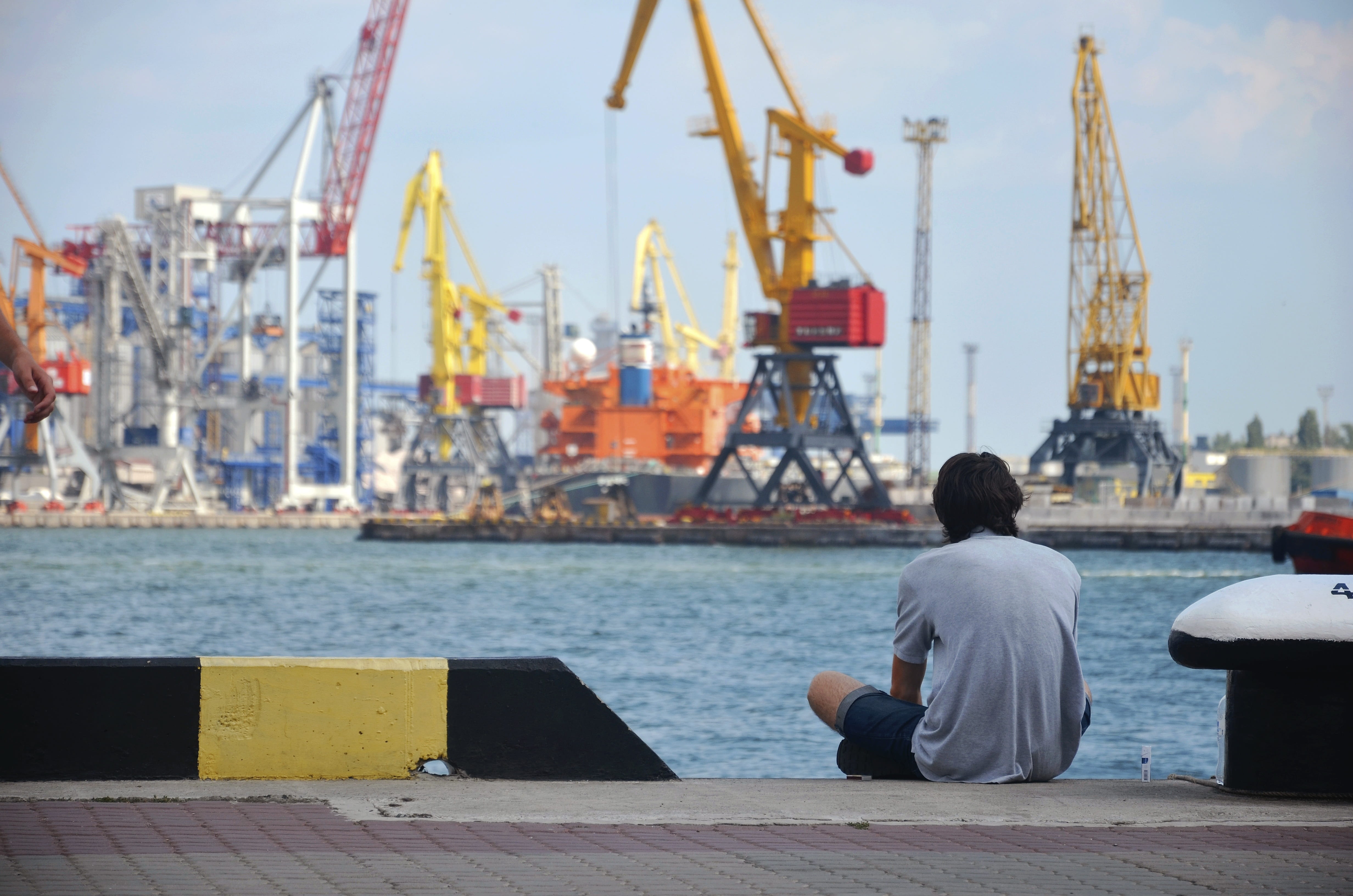 people near the water, architecture, thoughts, blue sea, man, blue, day, alone with a, harbor, focus on foreground, thoughtfulness, sitting, wave, leisure activity, HD Wallpaper