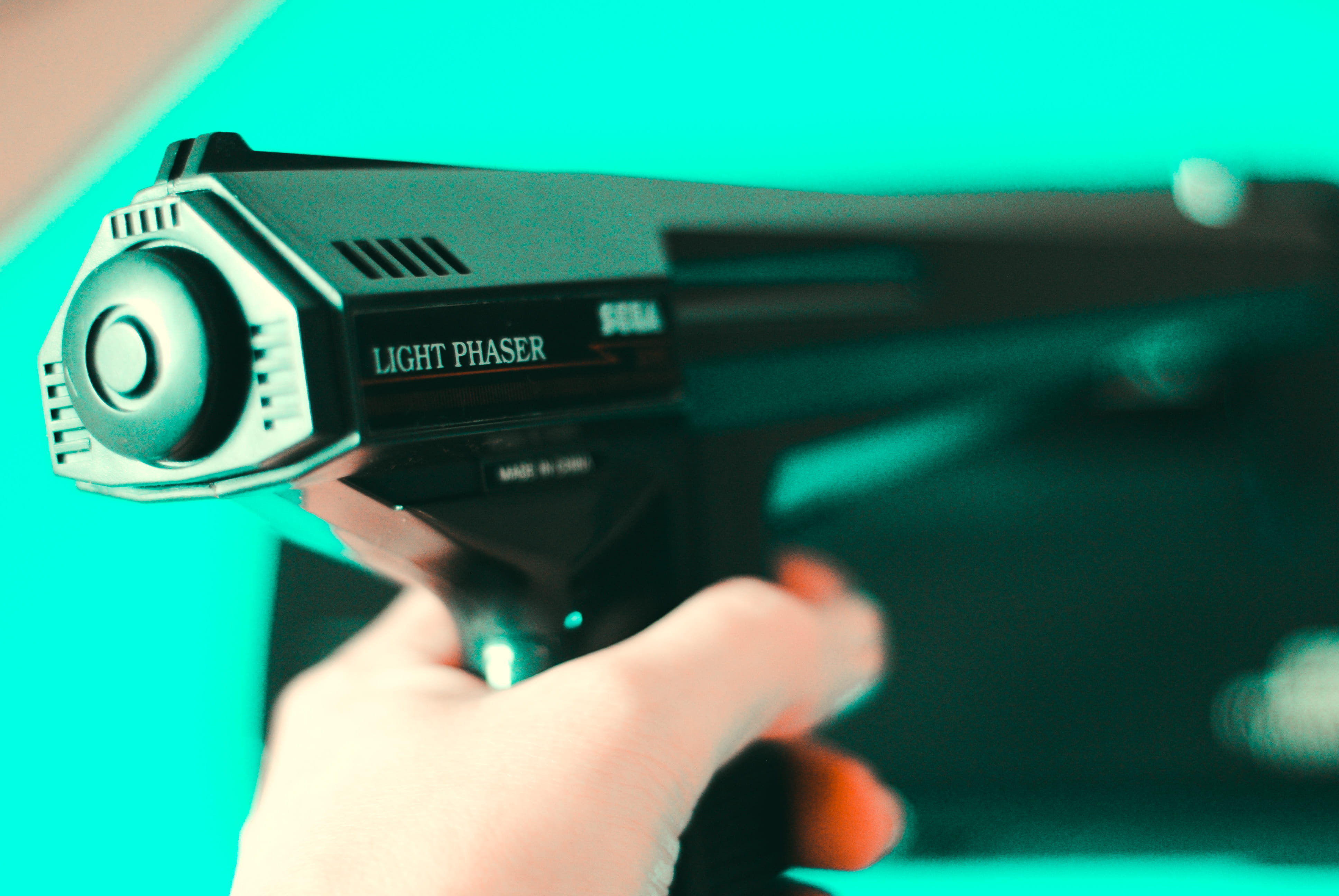 one person, tech, phaser, camera, human finger, arts culture and entertainment, gun, black, selective focus, lighter, weapon, human hand, videogame, futuristic, HD Wallpaper