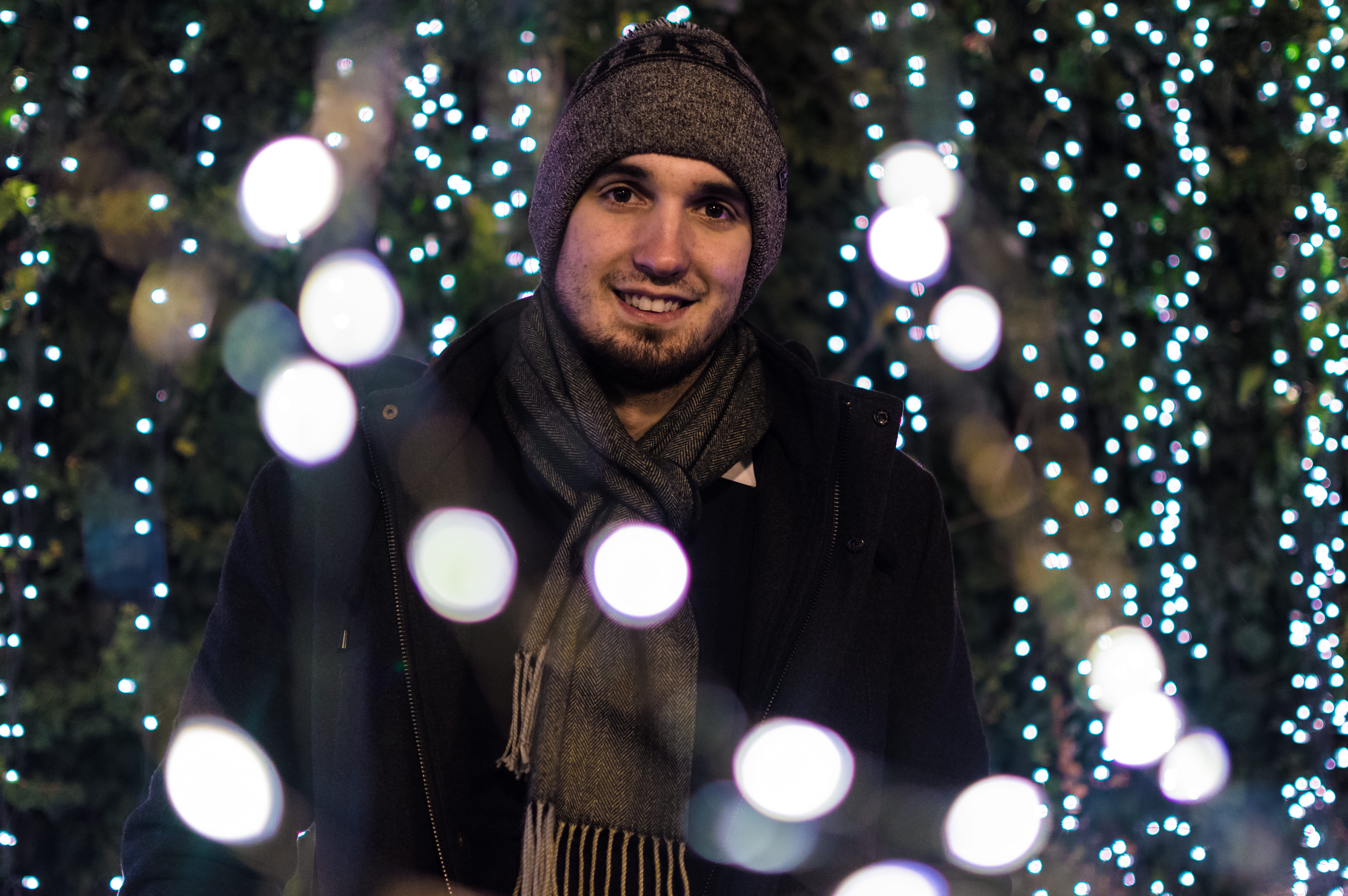 string lights, man, blurred background, beard, young men, one person, adult, scarf, hat, standing, long exposure, background, close -up, portrait, emotion, HD Wallpaper