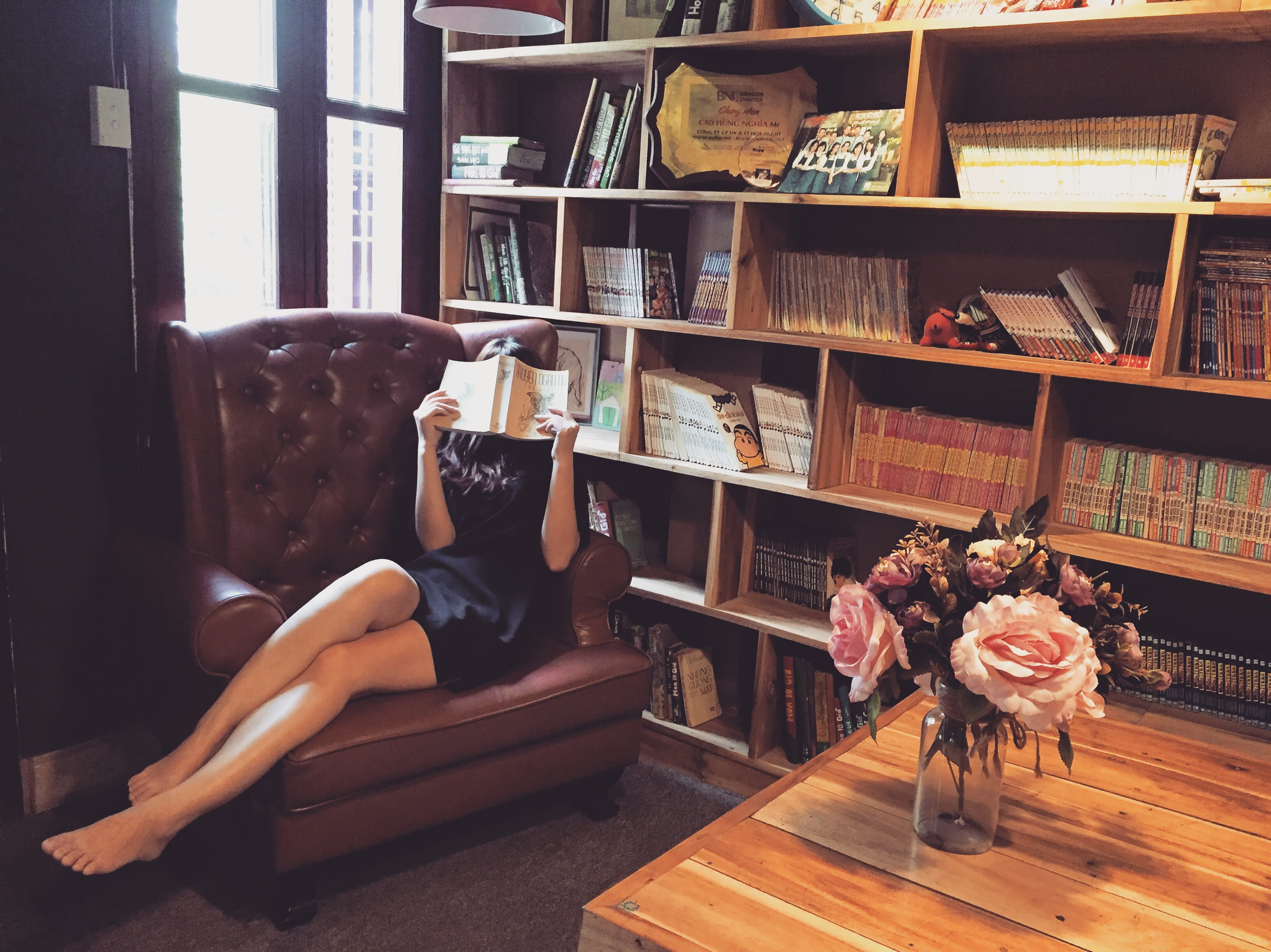 people, bookshelf, shelf, flooring, indoors, asian, real people, books, full length, seat, publication, furniture, reading, 2K, home interior, mini, book, HD Wallpaper