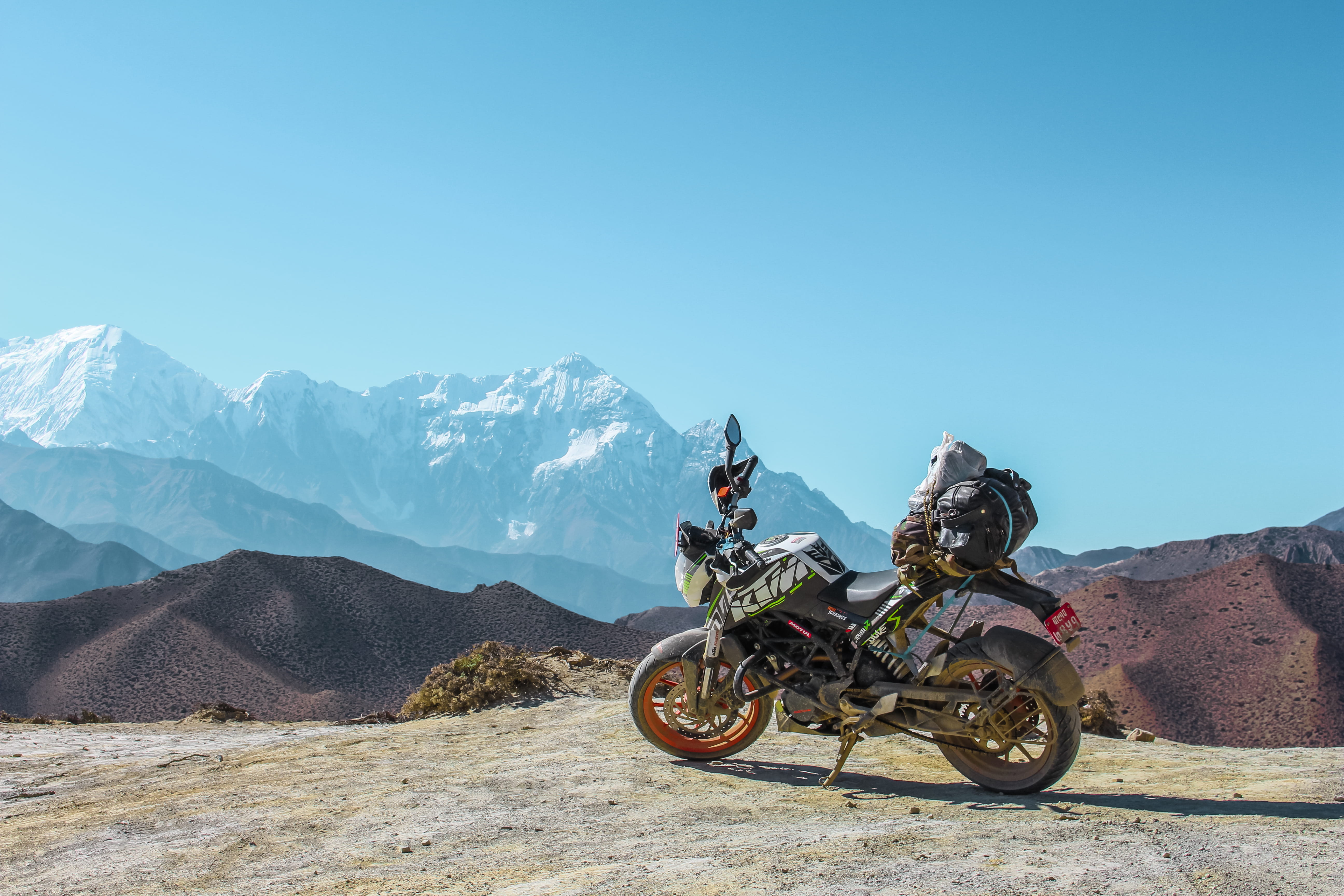 mountain, transportation, lifestyles, gray, parked, clear sky, distance, motorcycle, ride, real people, adventure, scenics - nature, riding, mode of transportation, HD Wallpaper